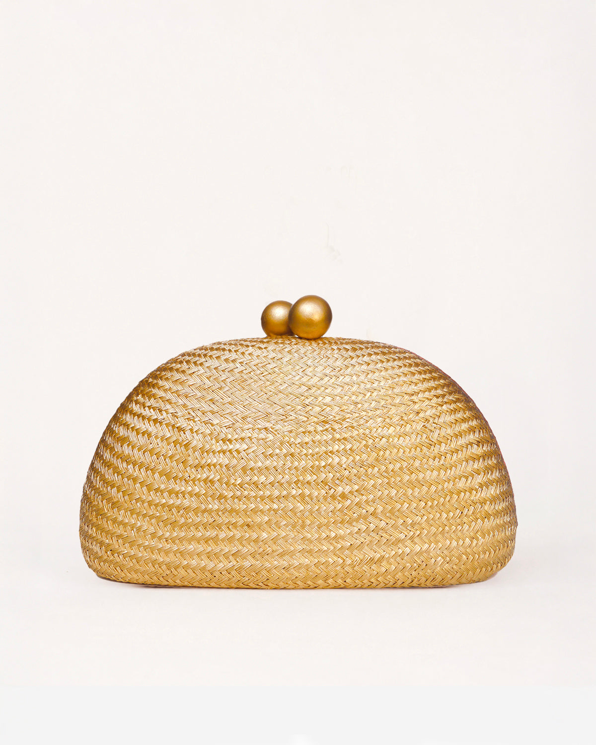 A woven straw dome clutch bag with a gold-tone wooden ball clasp  on a clean white background.