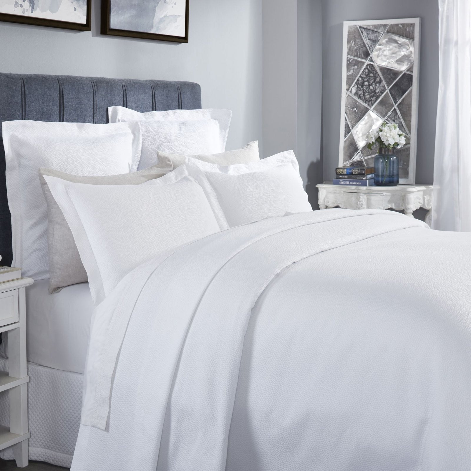 CL-258-9496_3|Crisp white coverlet featuring a delicate, subtle dimpled texture for a modern and clean bedroom design.