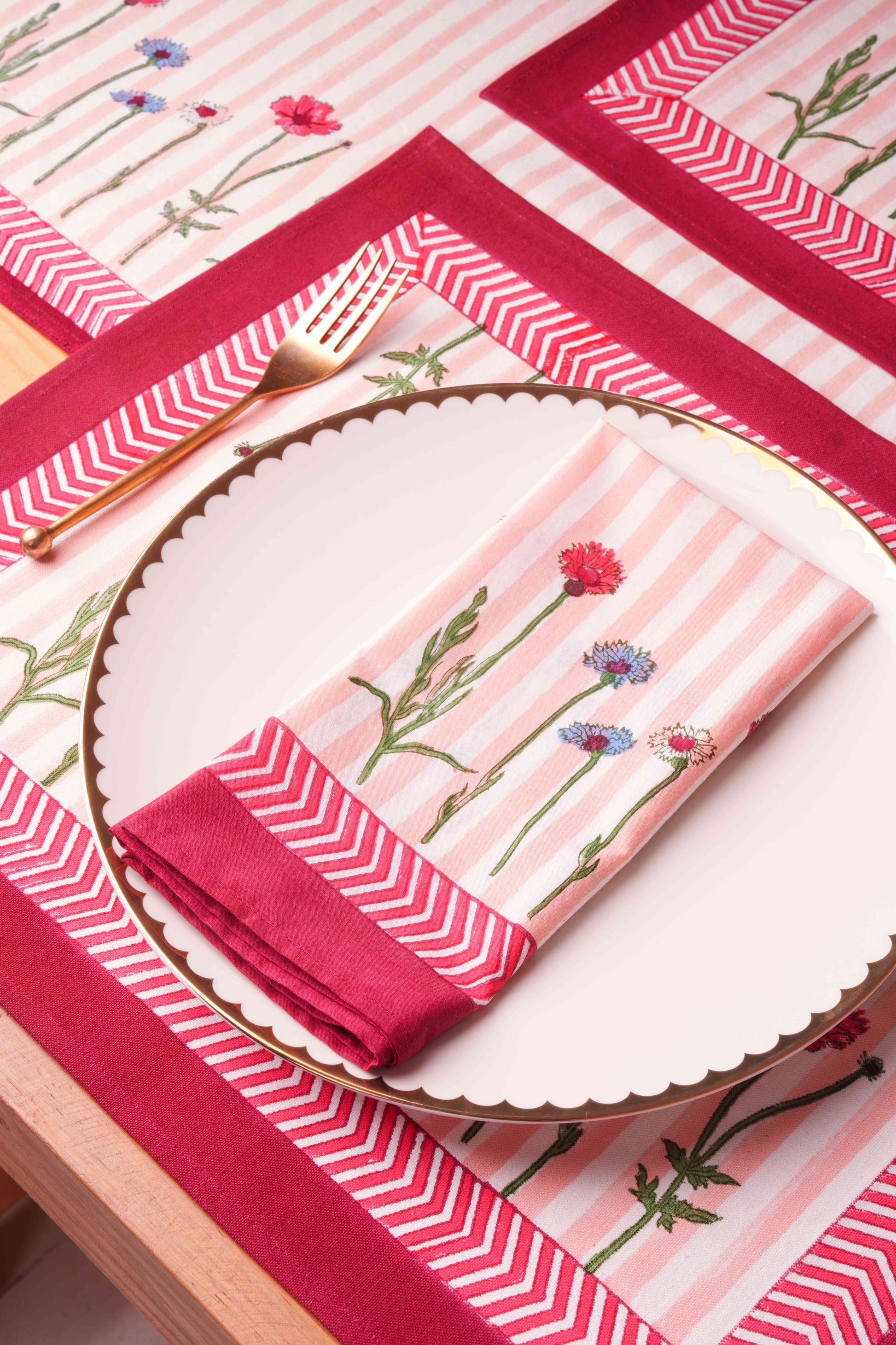 Plate with pink stripe wildflower napkin on matching placemat - Inner Child