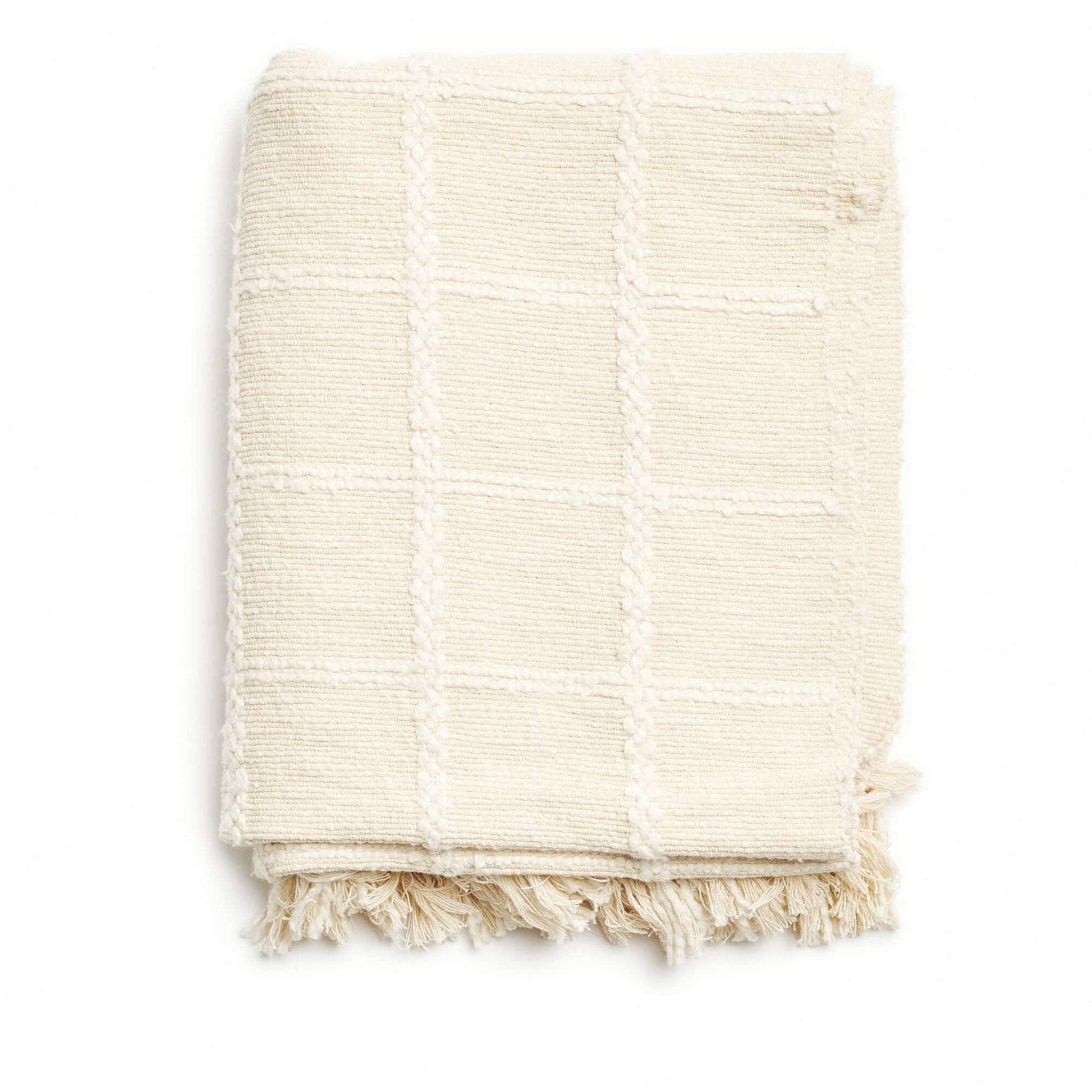 Sea Shell White Textured Checks Handloom Throw folded with checked pattern and fringes, handwoven cotton textile.