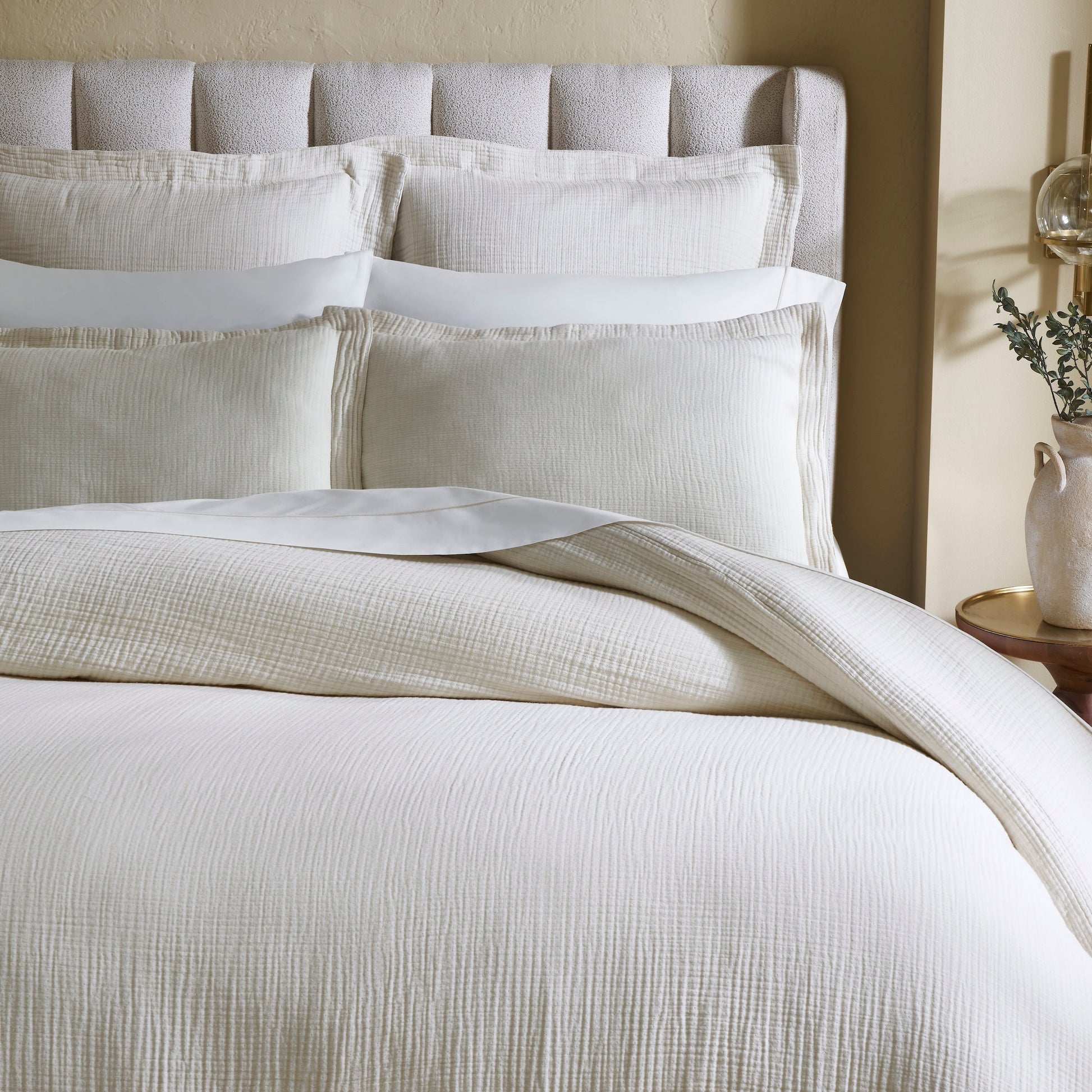 DT-049-9092_3|Close-up of cream textured duvet cover, soft crinkled fabric adding a relaxed and inviting touch to luxury bedding.