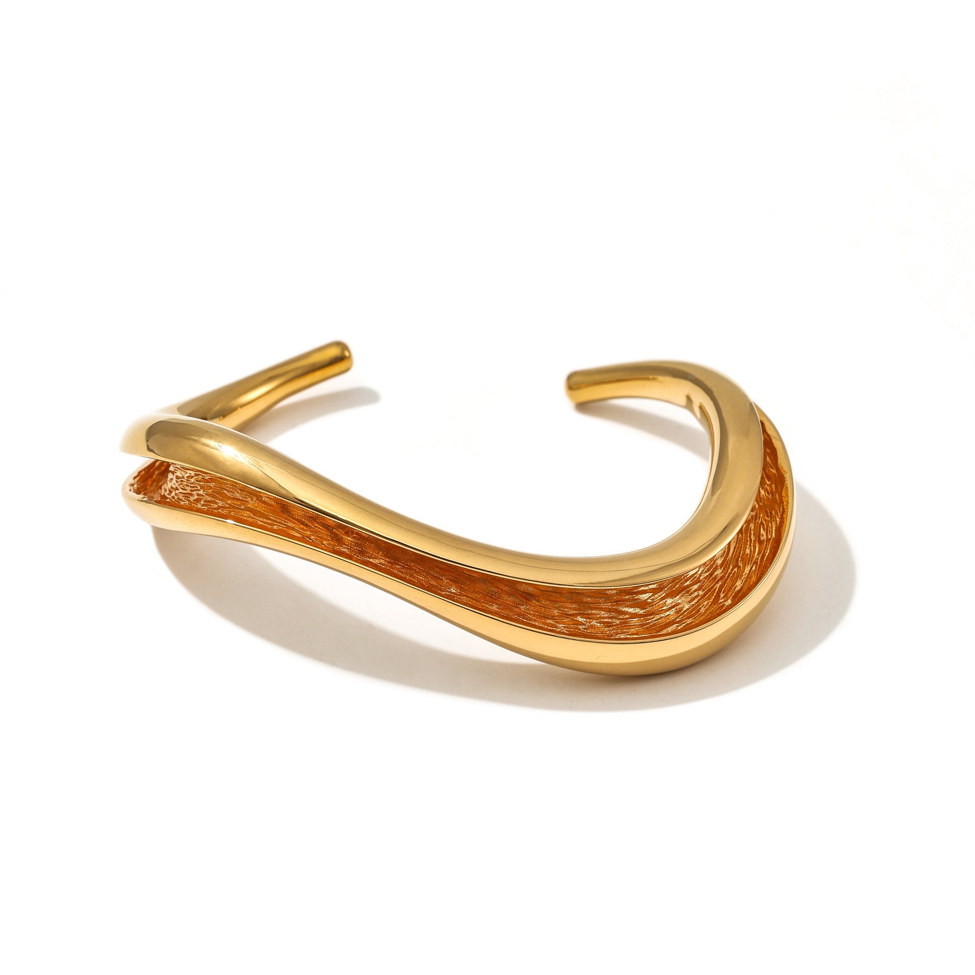 Currents Wave Cuff Bracelet smooth exterior with textured interior inspired by currents