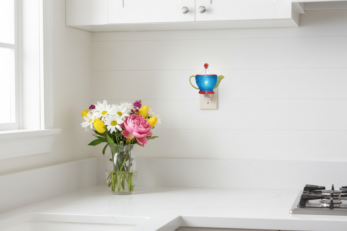 Beaded teapot night lights plugged into a farmhouse kitchen wall with bright natural light