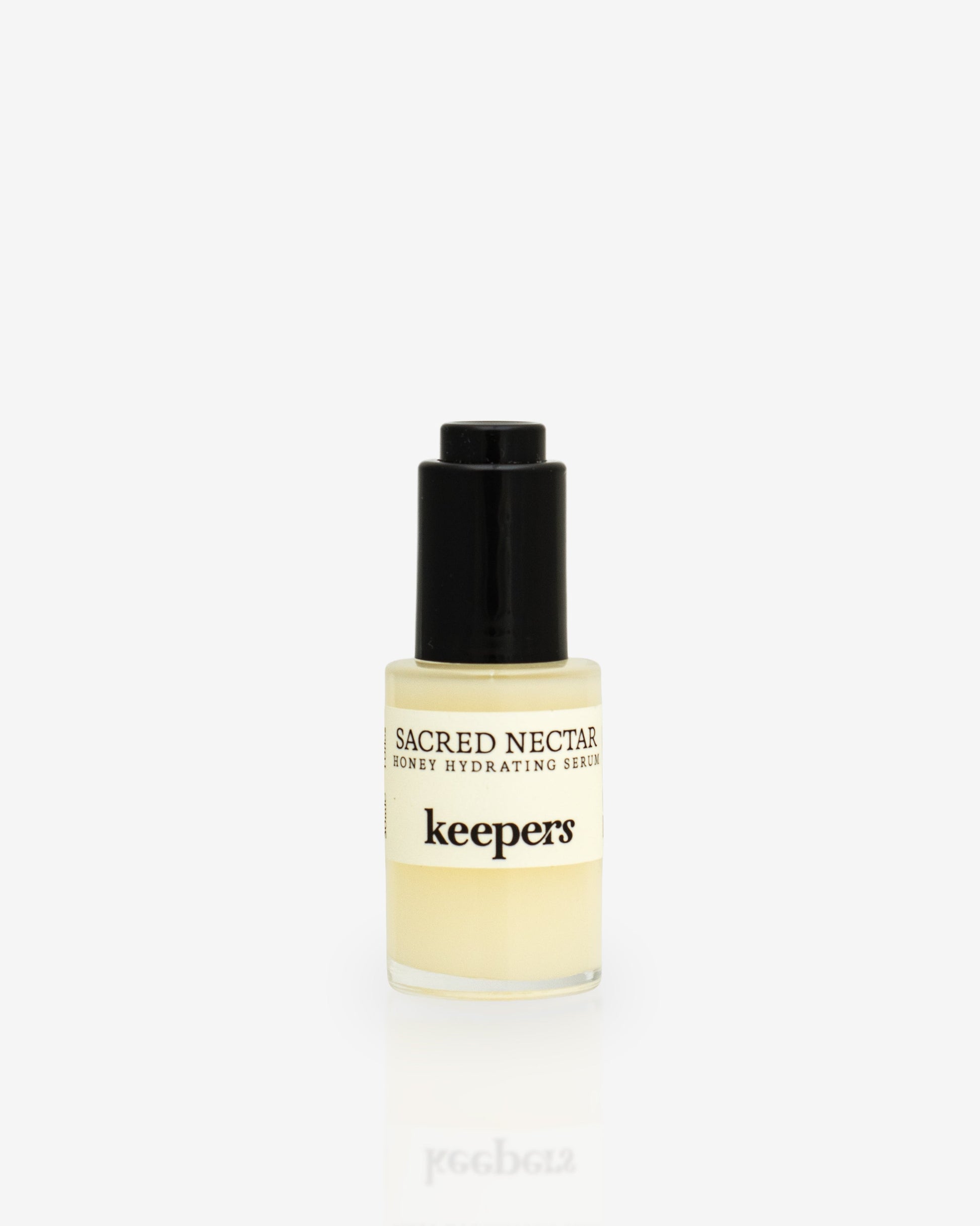 Sacred Nectar hydrating serum bottle on white background