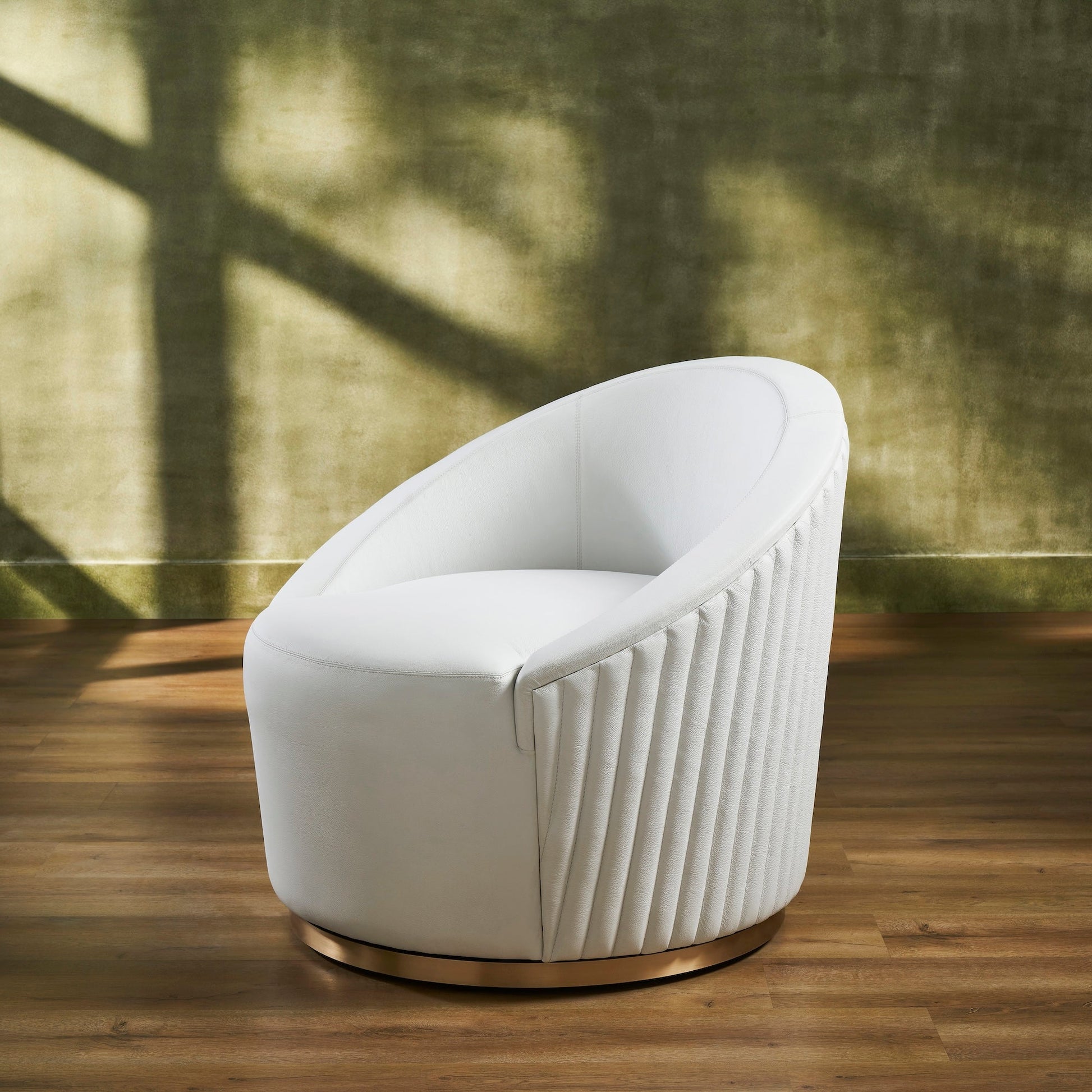 FN-5206-353529_3|Stylish white leather swivel armchair showcasing distinctive vertical ribbed texture on side and a chic round gold metal base.