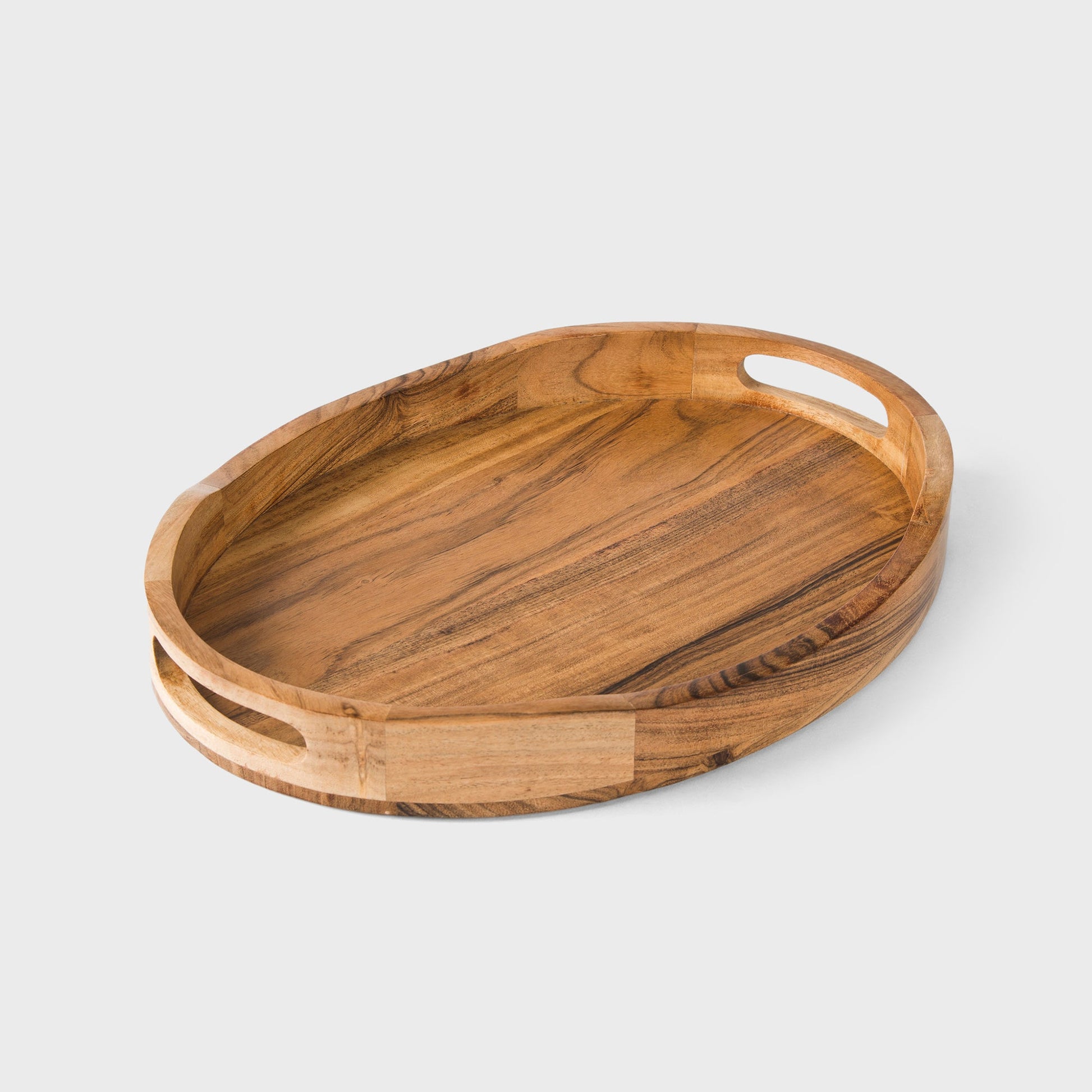 Natural acacia wood oval serving tray with carved cutout handles