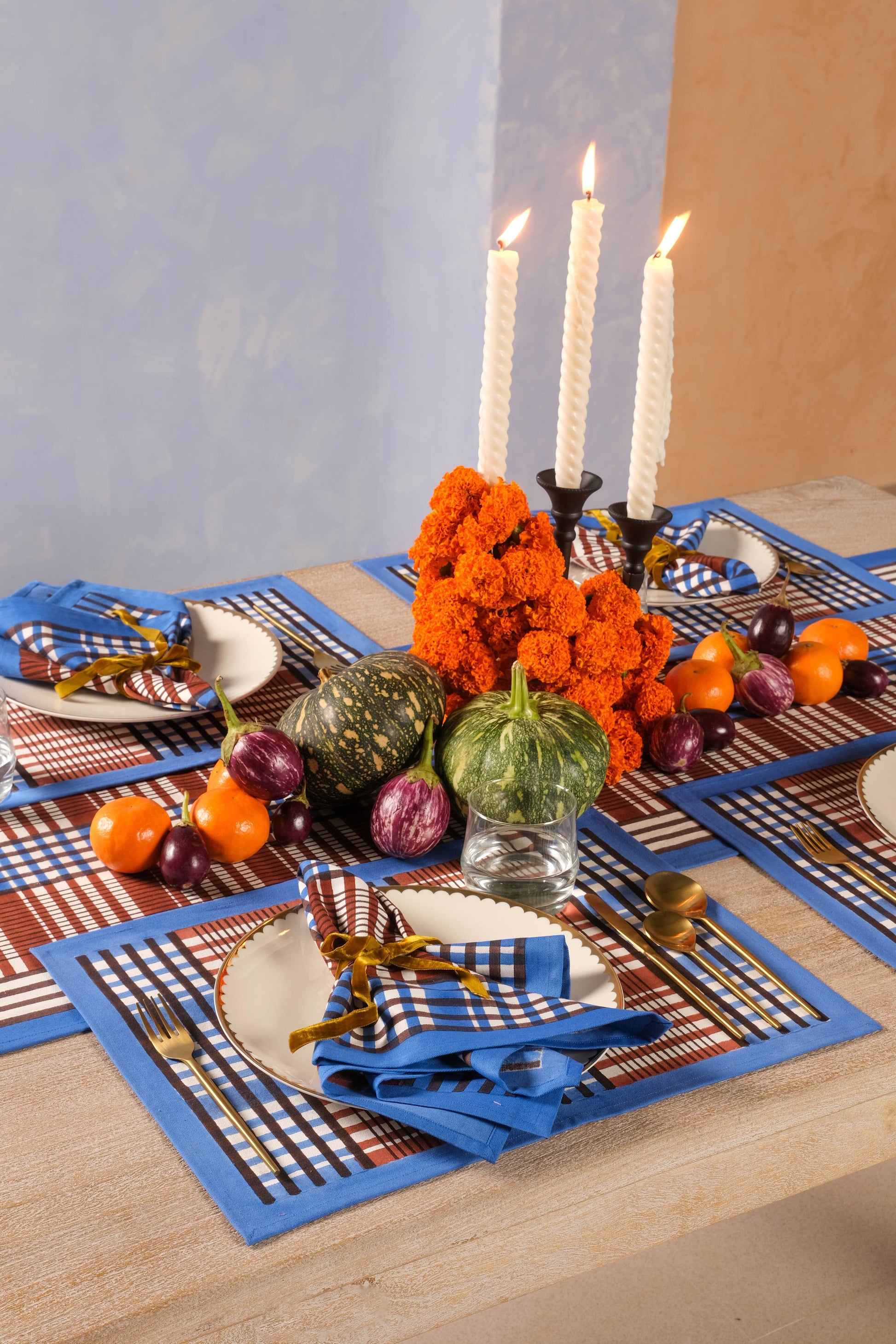 Dining table setup with Shetland plaid blockprint placemats and napkins from Inner Child
