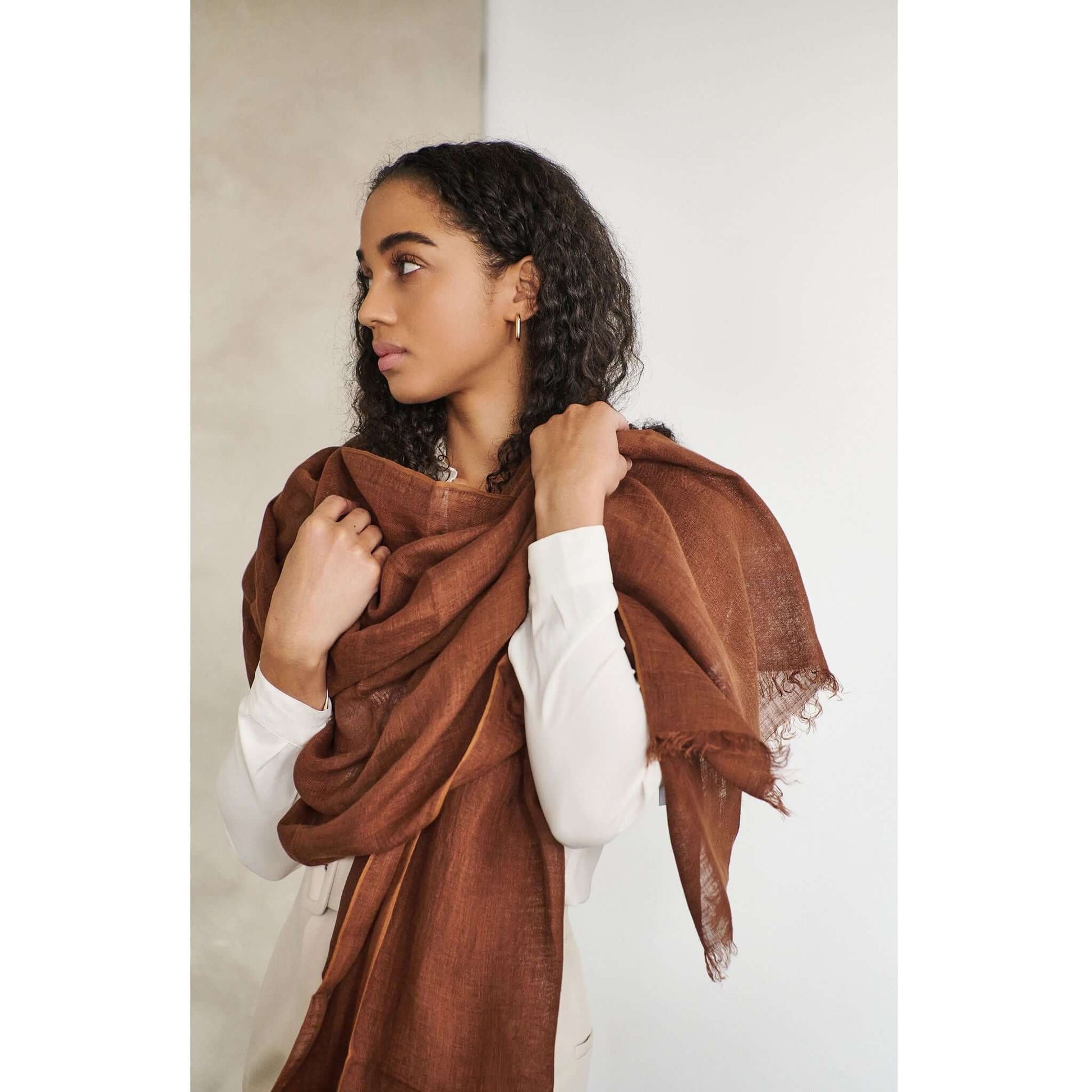 Coco Brown Hand Woven Linen Silk Blend Scarf worn elegantly by model, showcasing its soft texture and beautiful color.