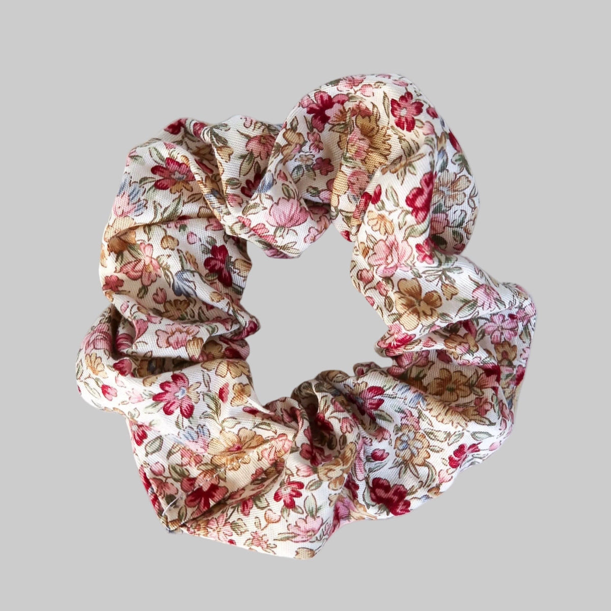 Floral patterned scrunchie on a gray background