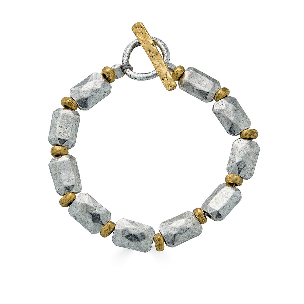 Bracelet with silver faceted rectangular beads and gold spacers, finished with a toggle clasp.