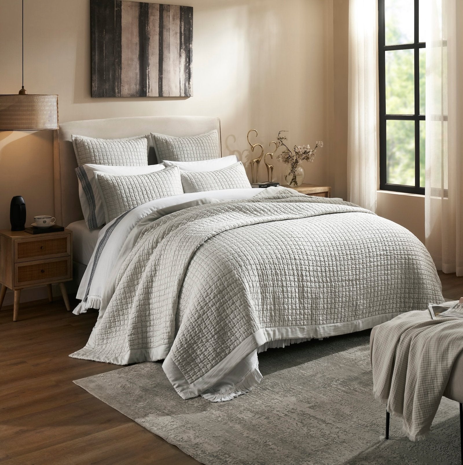 CL-198-9496_2|Grey quilted coverlet with a subtle grid pattern layered on a bed in a contemporary bedroom setting. Enhances style.