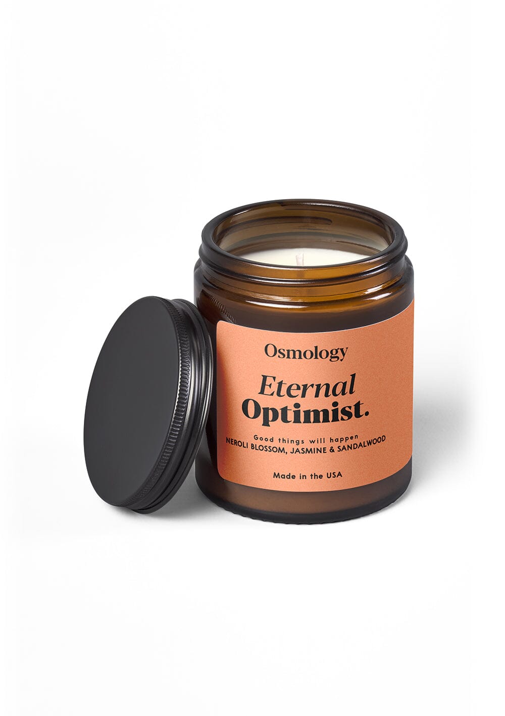 Osmology Eternal Optimist Jar Candle with lid off, on cream background