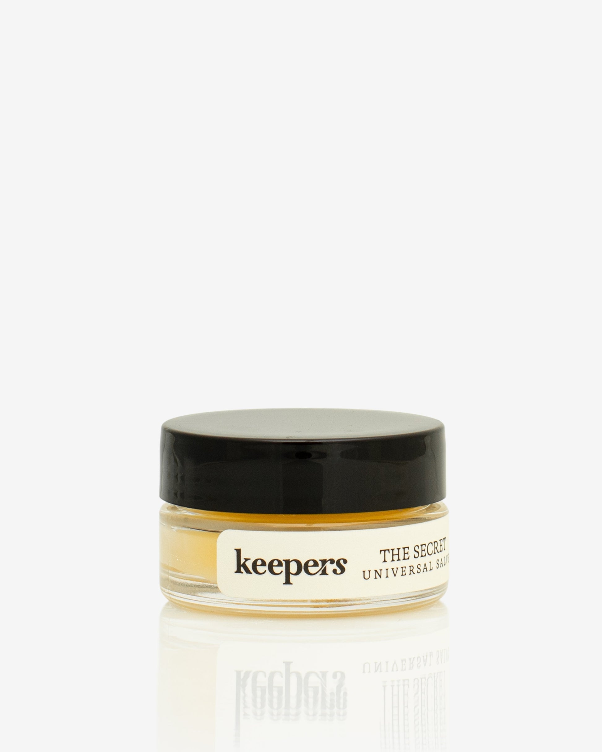 The Secret universal salve tin on a white background