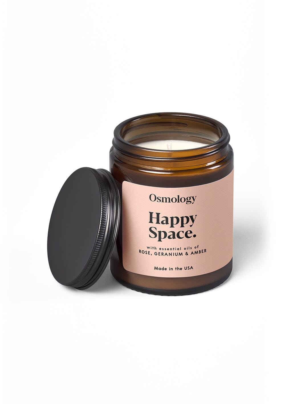 Osmology Happy Space jar candle with open lid, on orange-cream background