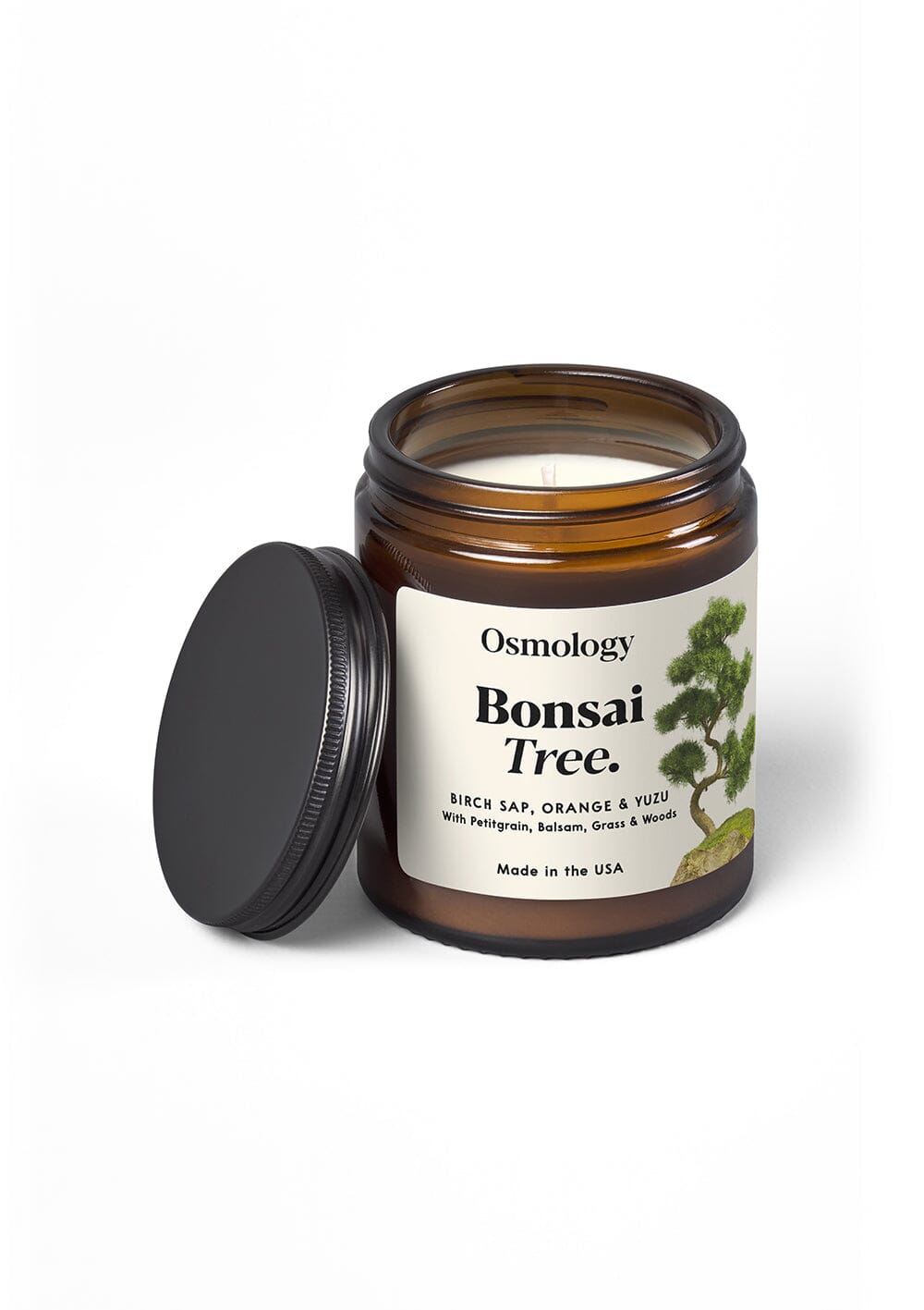 Osmology Bonsai Tree Jar candle, with opened lid, on cream background