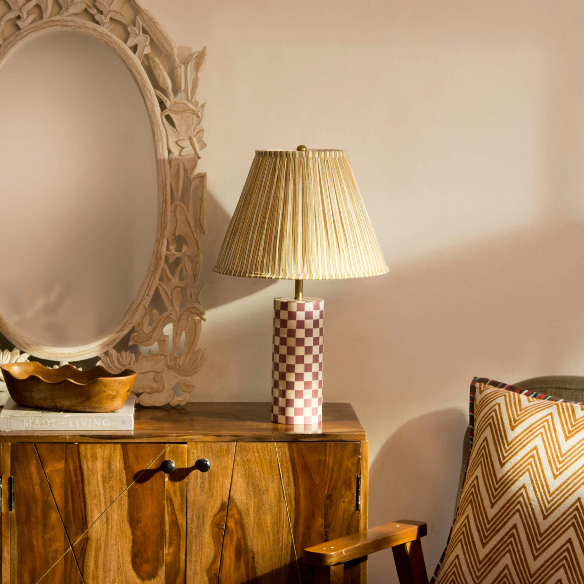 Close-up of the crisp vertical pleats on a yellow striped cotton lamp shade.