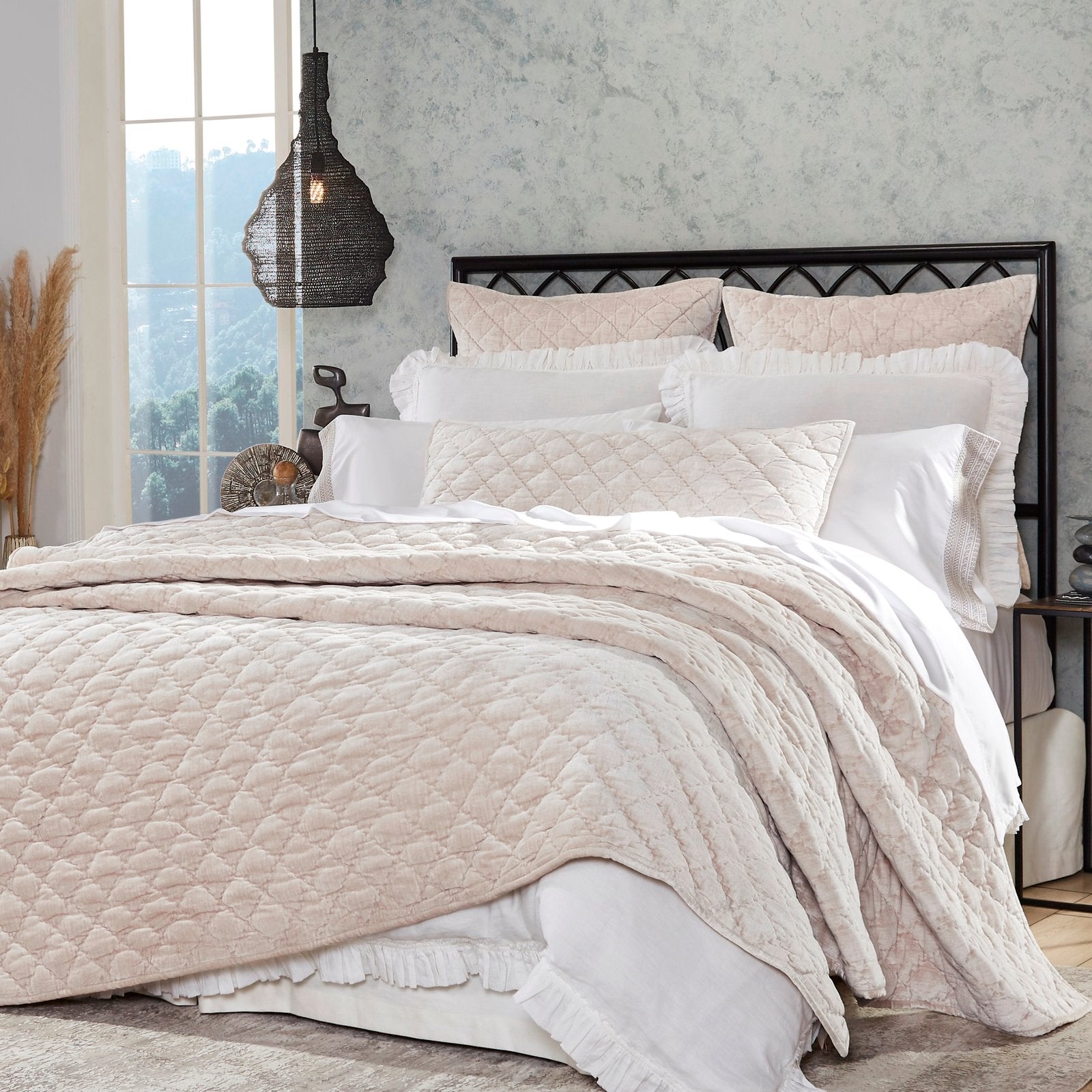 QT-342-11096_5|Luxurious blush pink quilt featuring a delicate diamond stitch, draped elegantly over a queen bed in a stylish bedroom.