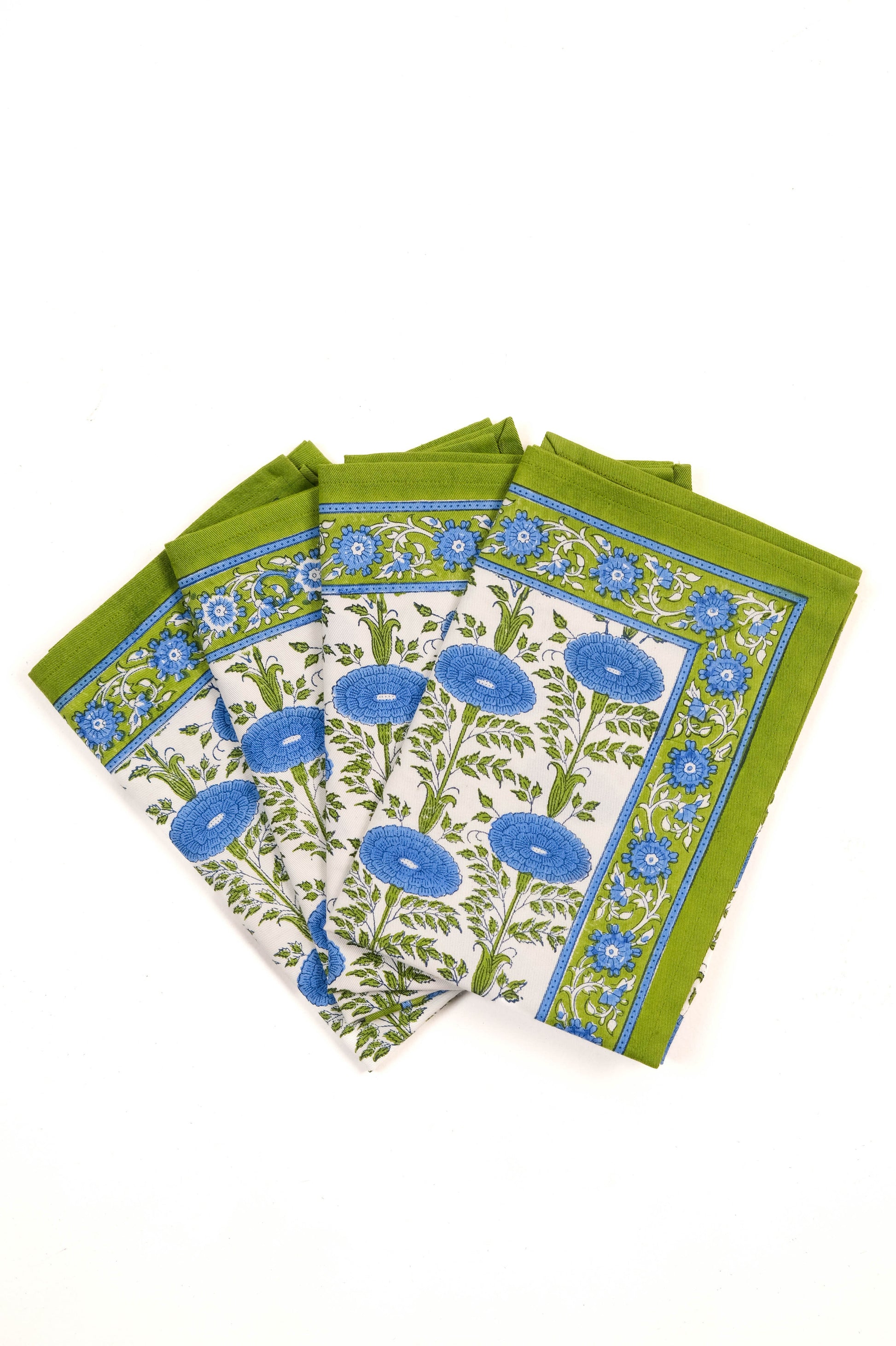 Set of four blue araminta blockprint napkins arranged fanned out