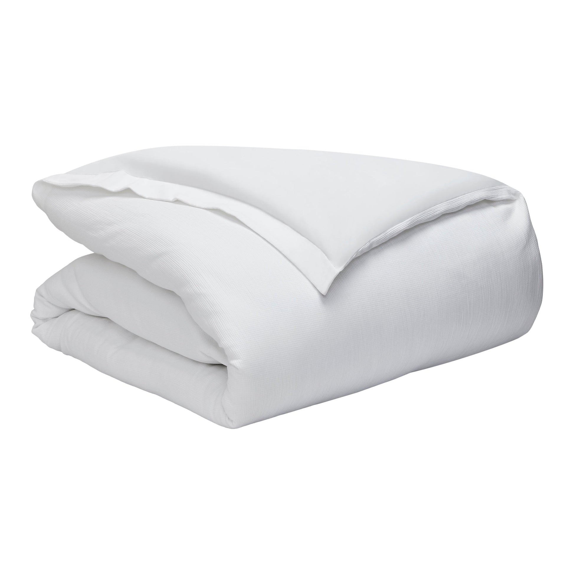DT-067-10692_8|Crisp white textured duvet cover, folded neatly, providing ultimate luxury and hotel-quality comfort for elegant bedroom decor.