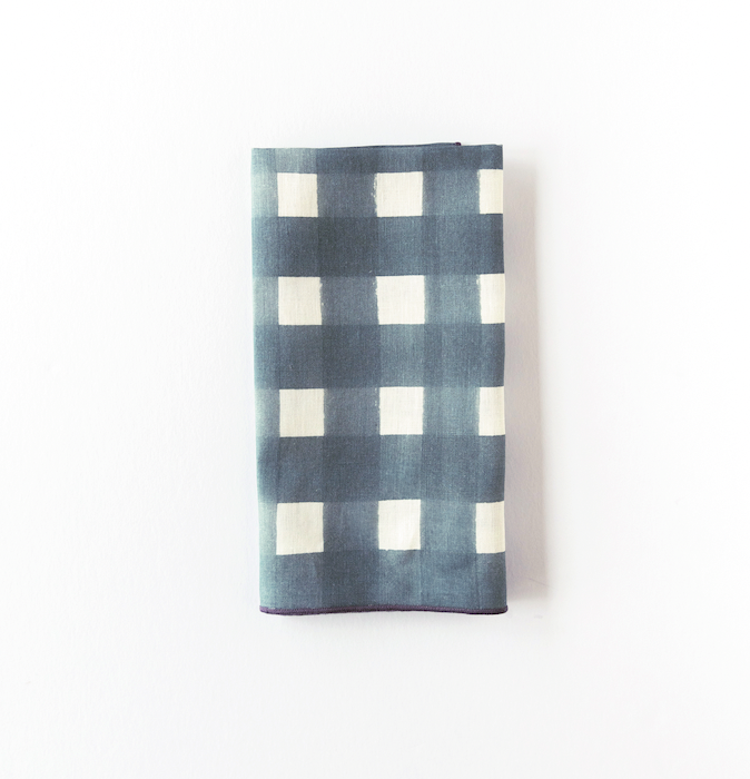 Blue Cross-Hatch linen dinner napkin styled on place setting - Goldie Home