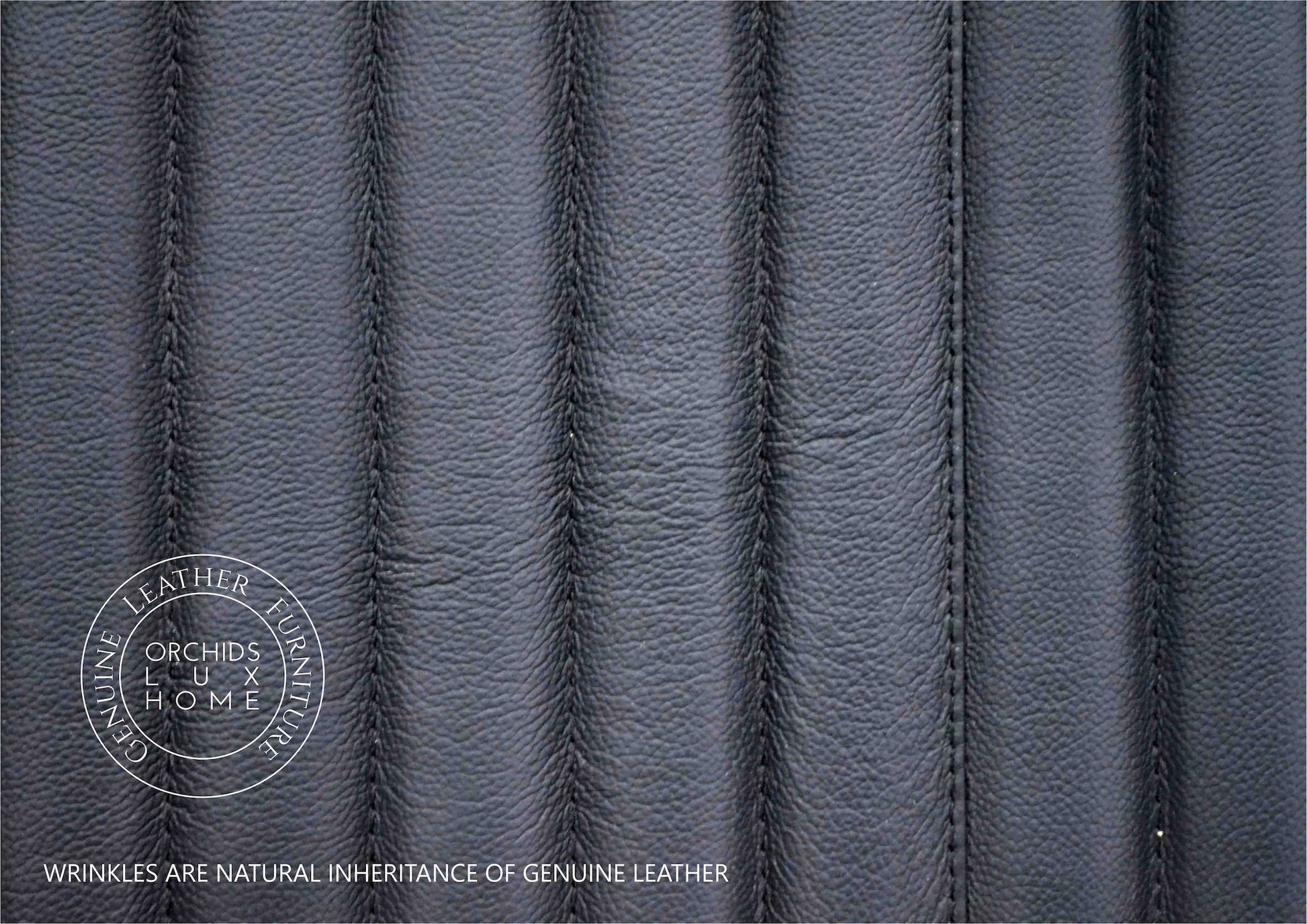 FN-5202-201828_6|Detailed texture of black genuine leather upholstery with vertical channel stitching, highlighting natural wrinkles inherent to real leather furniture.