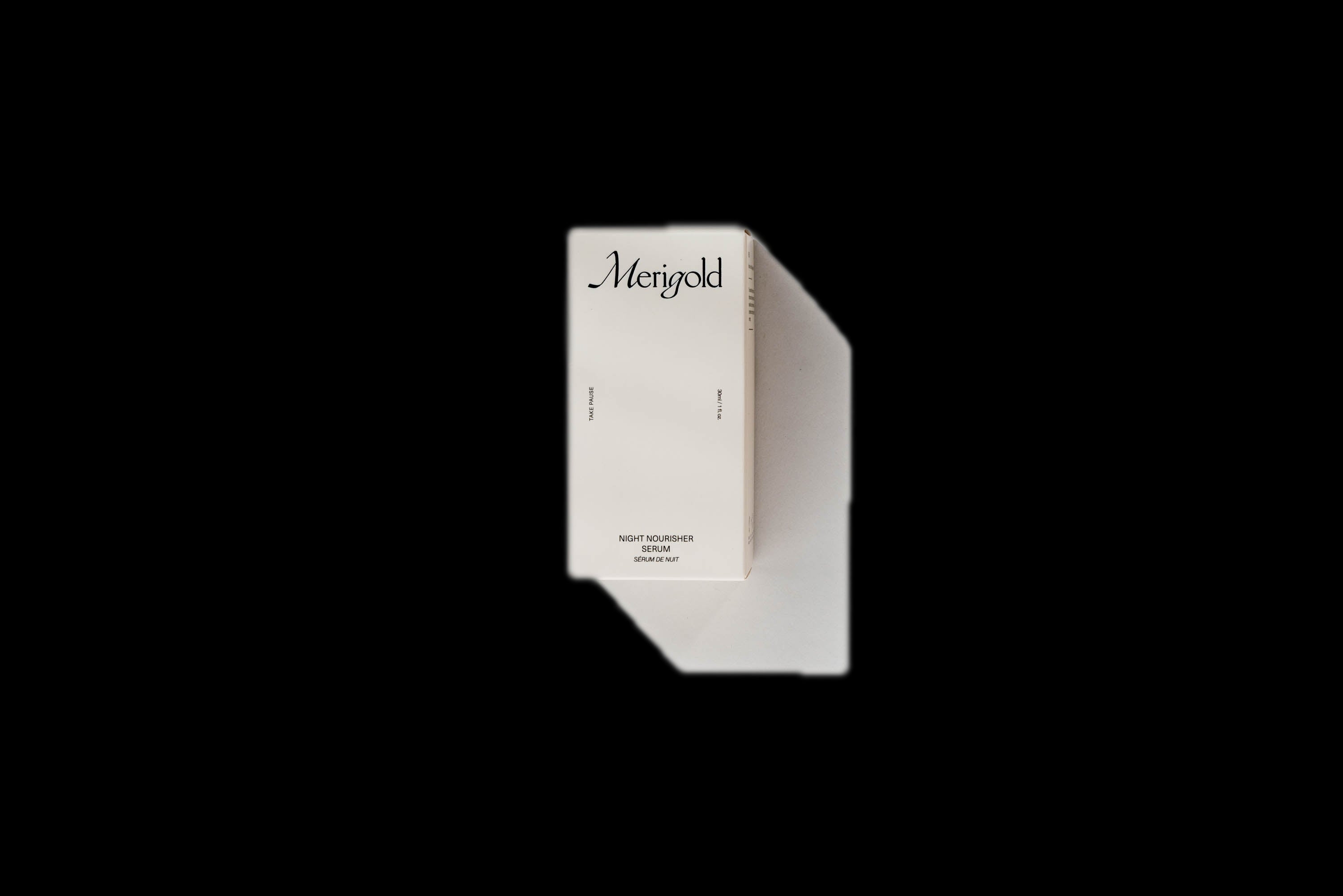 Merigold Night Nourisher Serum minimalist cream box on white background — luxury natural night serum for glowing skin