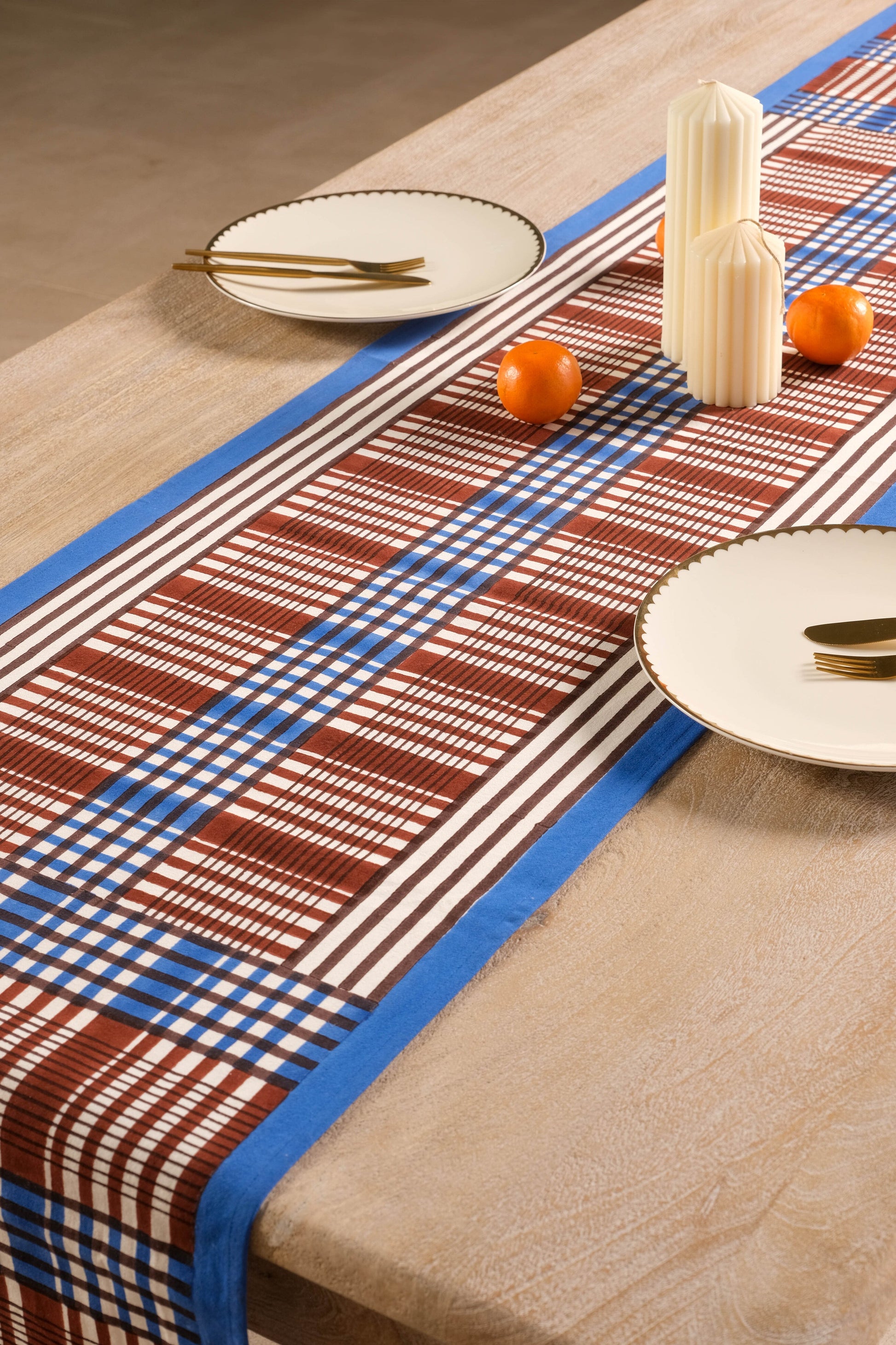 Shetland Plaid Blockprint Tablerunner in brown and blue on dining table
