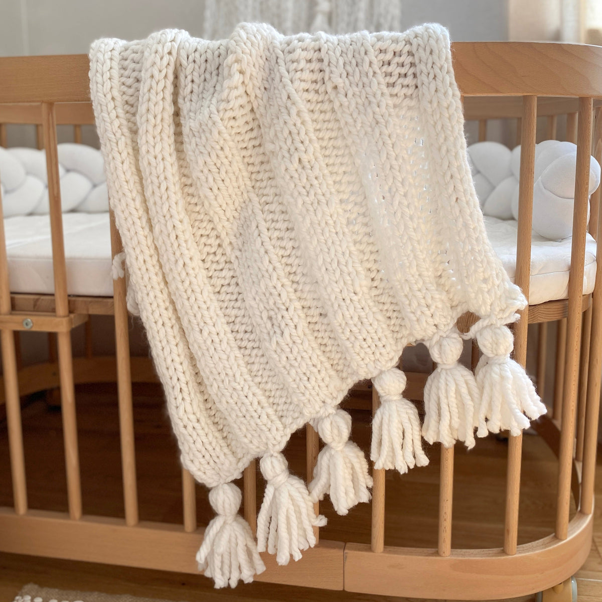 Boho knitted white baby blanket by Anzy home. baby shower gift for baptism or pregnancy congrats, for newborn photo props or as an expecting mom gift box.