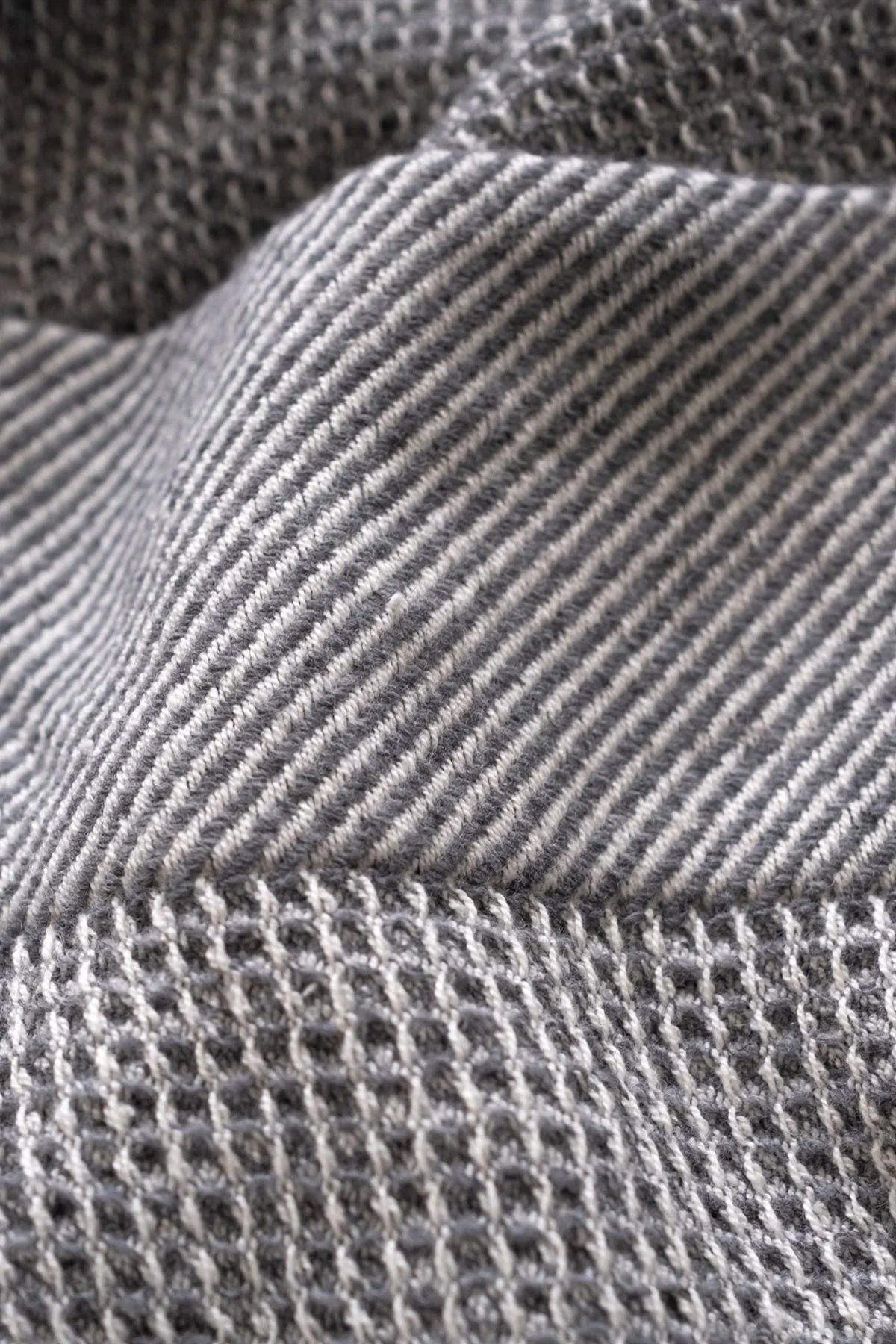 Close-up of gray waffle throw blanket
