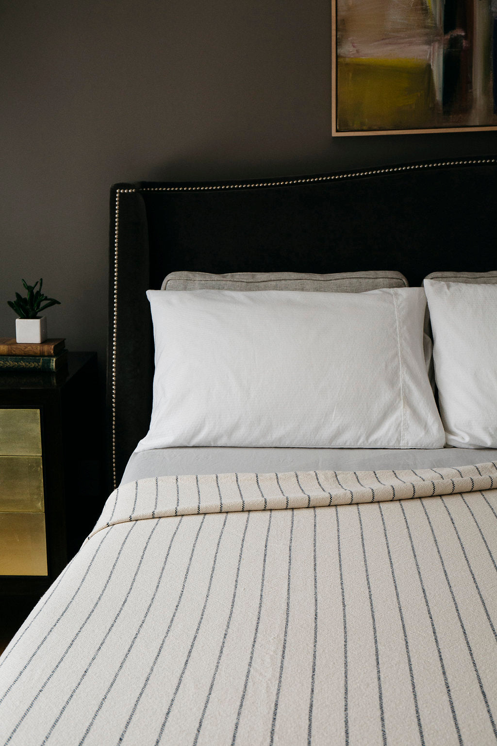 Experience the epitome of luxury with the Evangeline Linens' bed blanket. Crafted from 100% Cotton, this exquisite heirloom features a timeless pinstripe pattern. Available in king, queen, and twin sizes, it is not only durable and washable but also adds a touch of elegance to your bedroom.