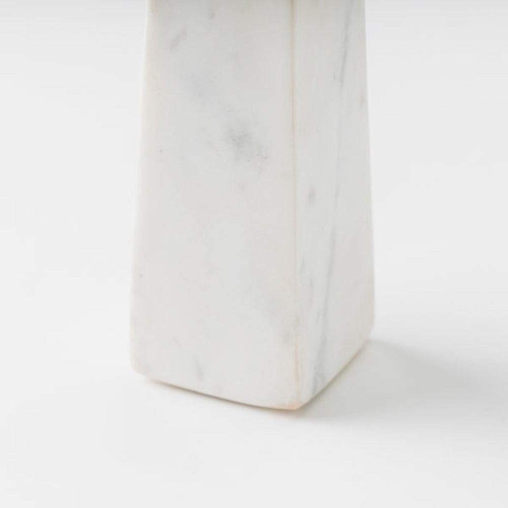 close-up of marble and wood contrast on candleholder
