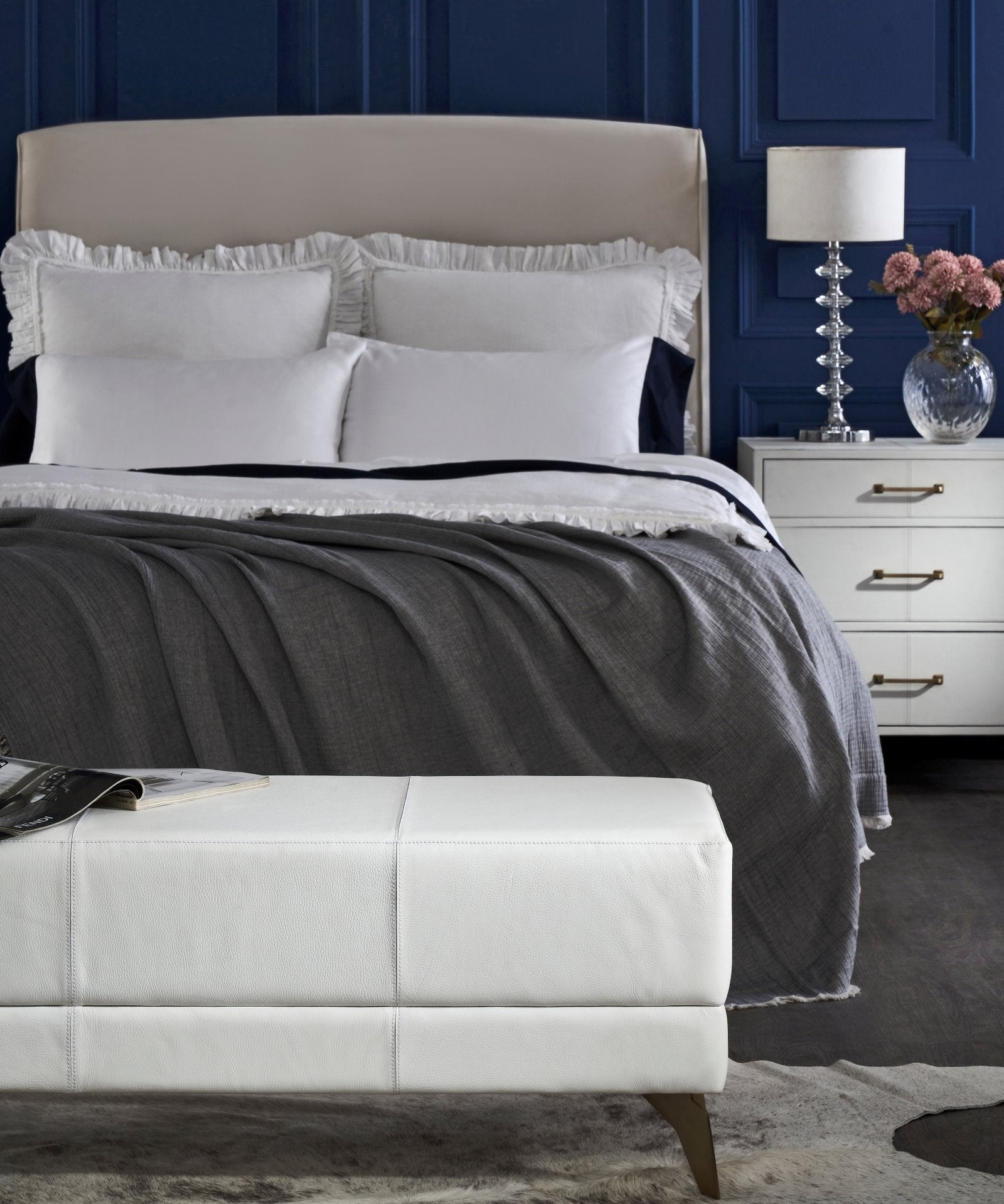 FN-5201-601618_6|Luxurious white genuine leather ottoman bench in a sophisticated bedroom setup, offering stylish and practical seating furniture.