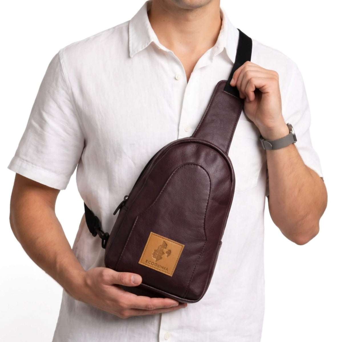 Buru plum vegan leather sling bag worn crossbody #color_plum
