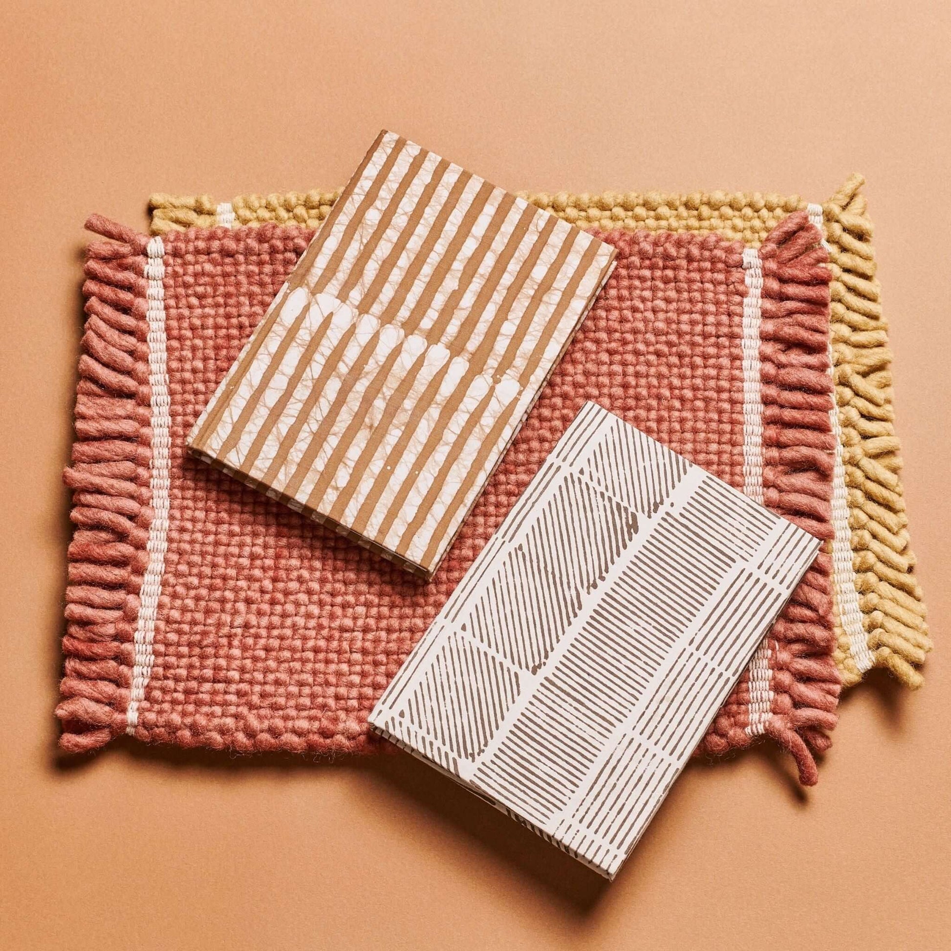 Bistre Black Zero Waste Handmade Artisanal Journal displayed on a textured mat with woven borders.