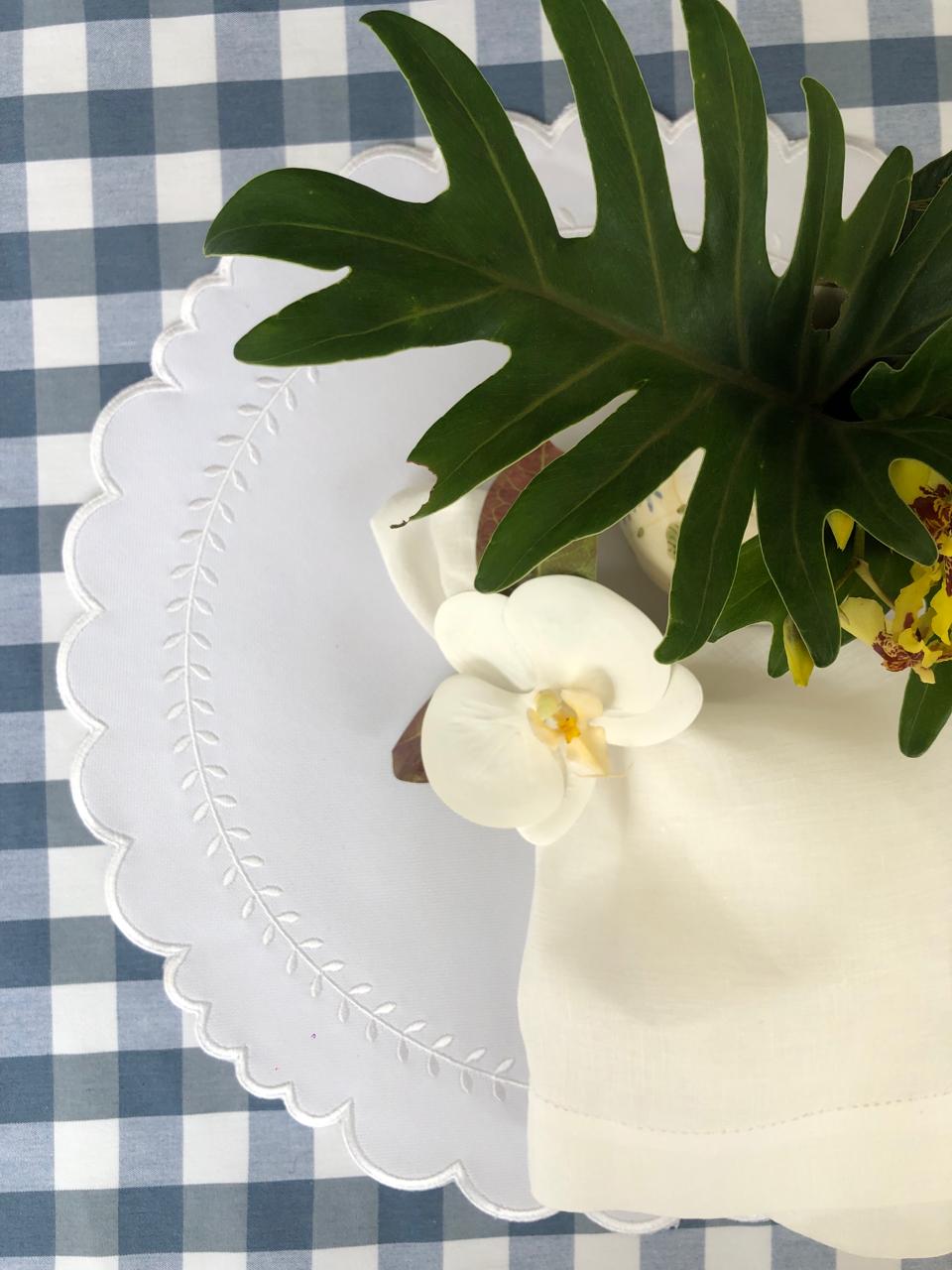 Arrow impermeable placemat with geometric border design in white by Talah Home