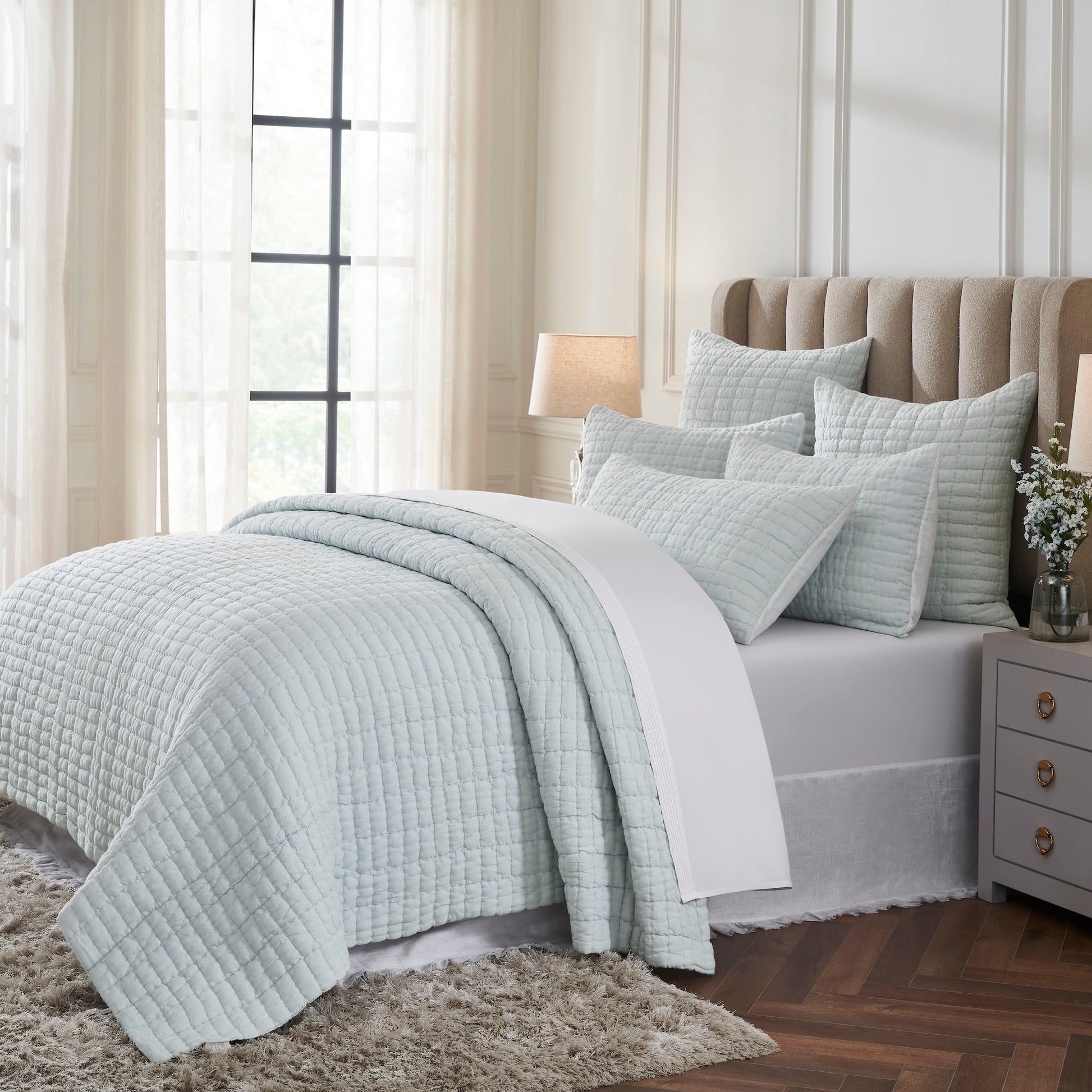 QT-373-11096_2|Cozy light blue textured quilt set enhancing a bright bedroom, providing soft comfort and an elegant, serene bedding ensemble.