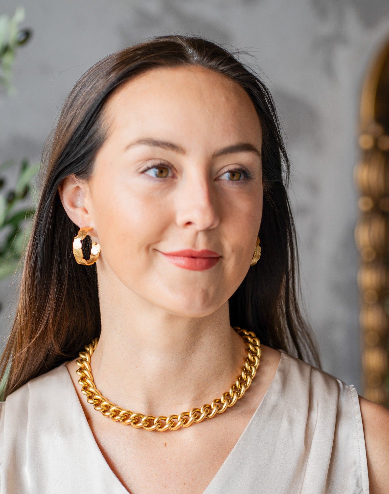 Chunky gold necklace with a large ridged heart charm and “grateful” tag, worn three ways