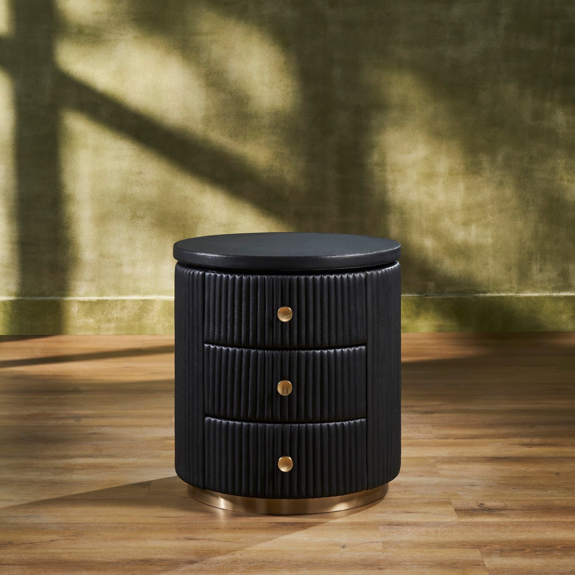 FN-5213-202022_1|Elegant black fluted leather round nightstand with three brass pull drawers, perfect luxury leather bedroom furniture.