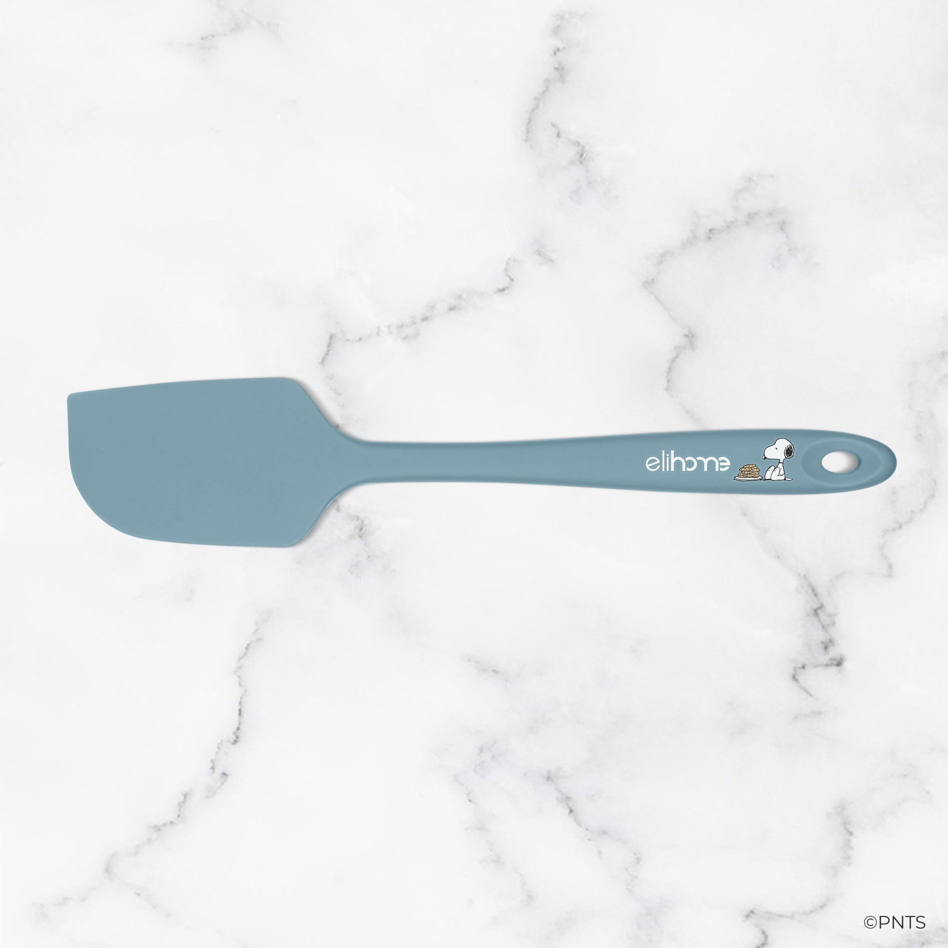 Blue spatula on a marble background