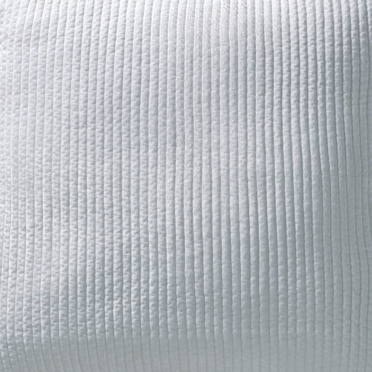 CL-157-9496_1|Crisp white textured coverlet on a luxurious bed, offering a serene, elegant touch to modern bedroom decor.