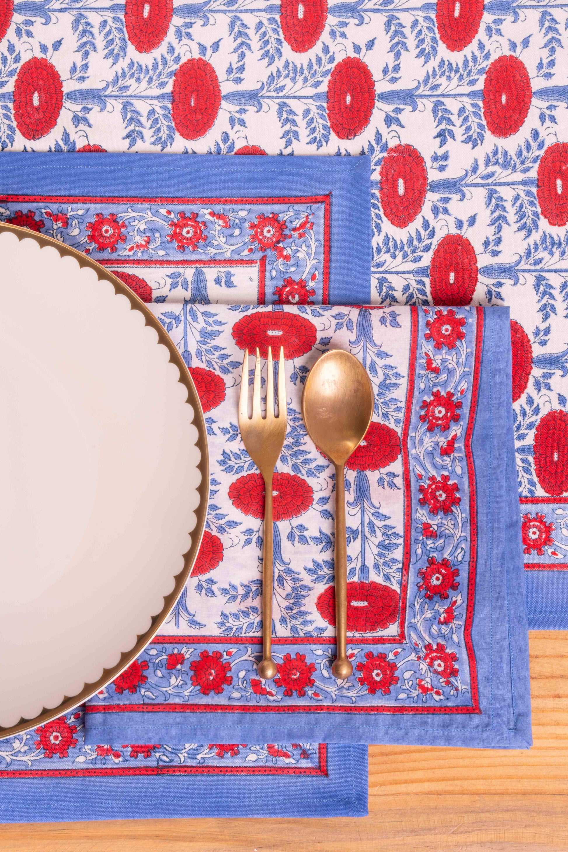 Close-up of Araminta blockprint placemat with gold utensils, Inner Child