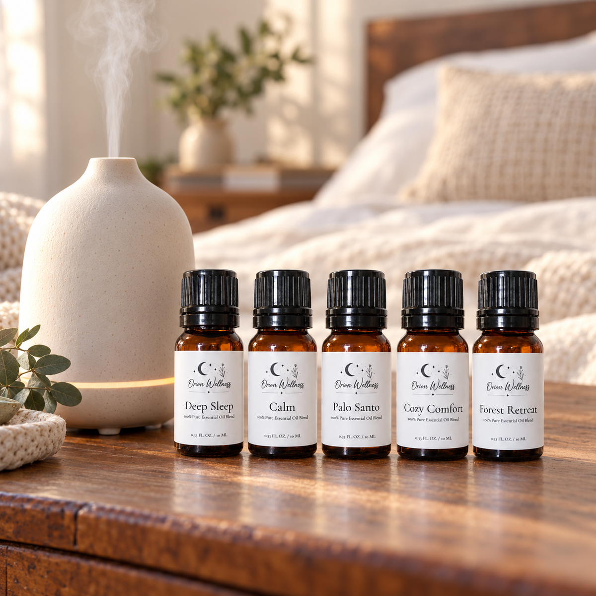 Orion Wellness evening diffuser blend set beside a running diffuser