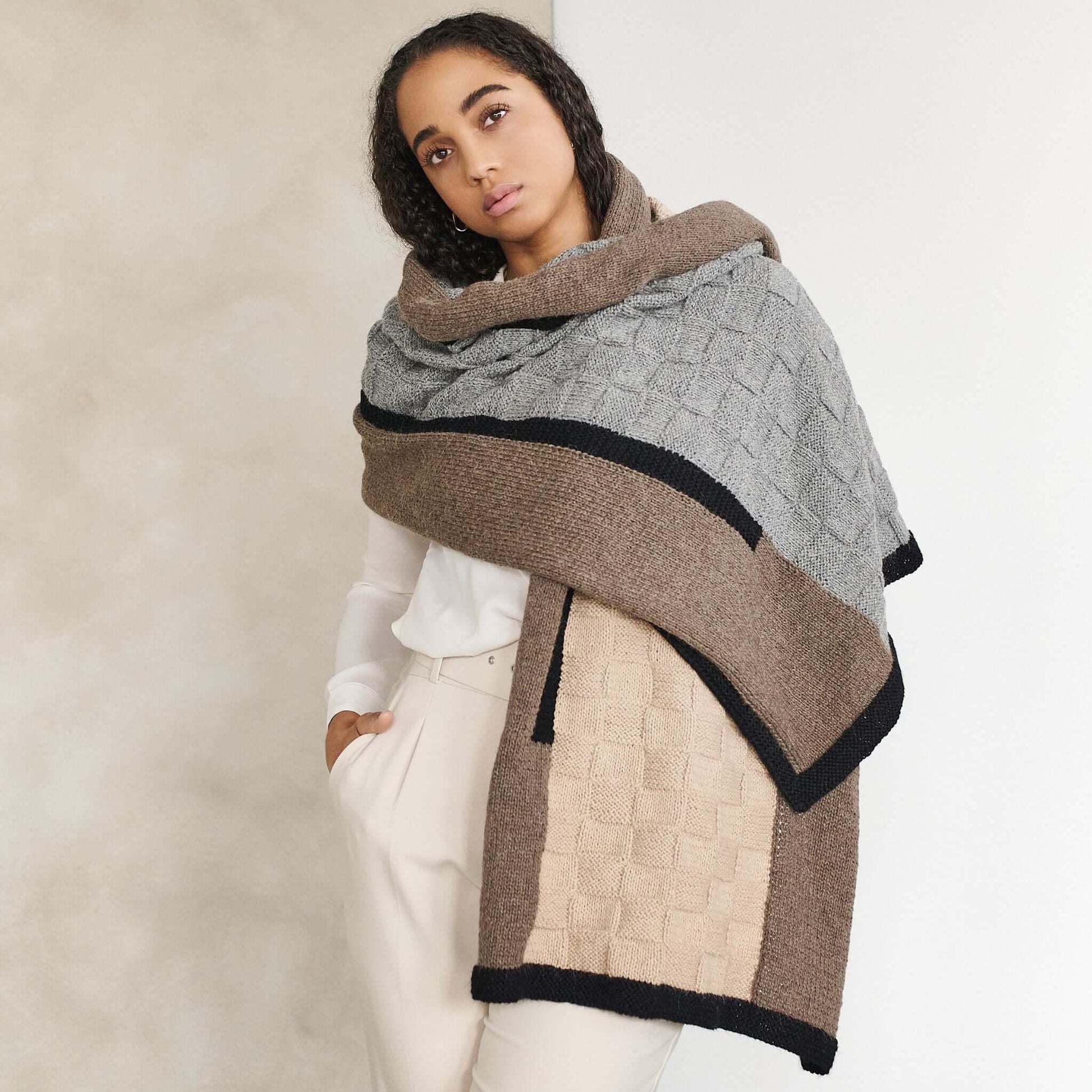 Muhu Brown Gray Hand Knitted Peruvian Alpaca Blanket / Large Plush Scarf styled as a luxurious wrap.