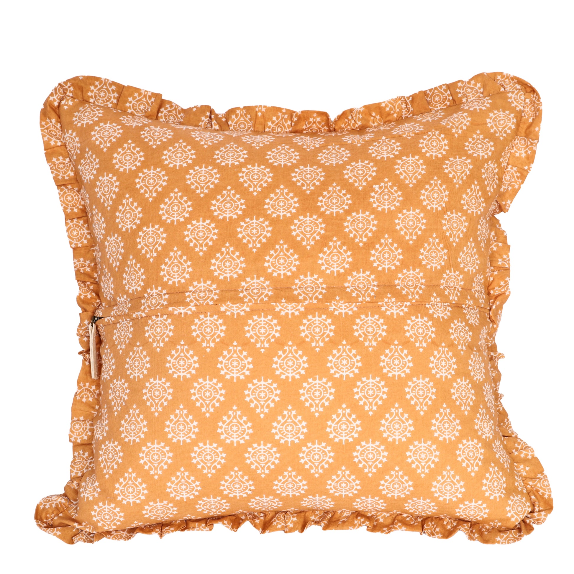 Orange block-printed pillow cover with insert half inserted