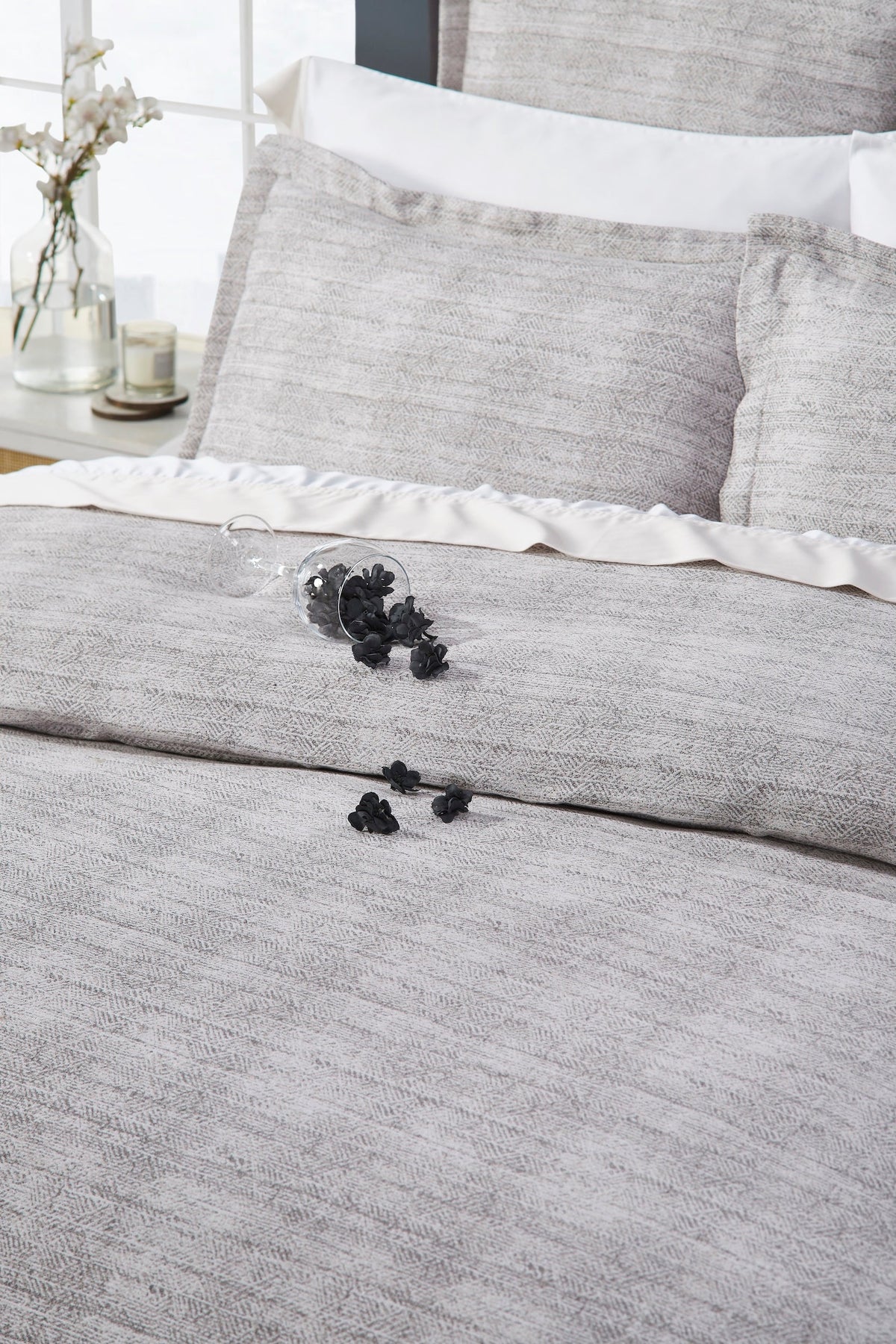 DT-032-10692_4|Intricate close-up of a light grey textured duvet cover, highlighting its subtle pattern and luxurious, comfortable fabric.