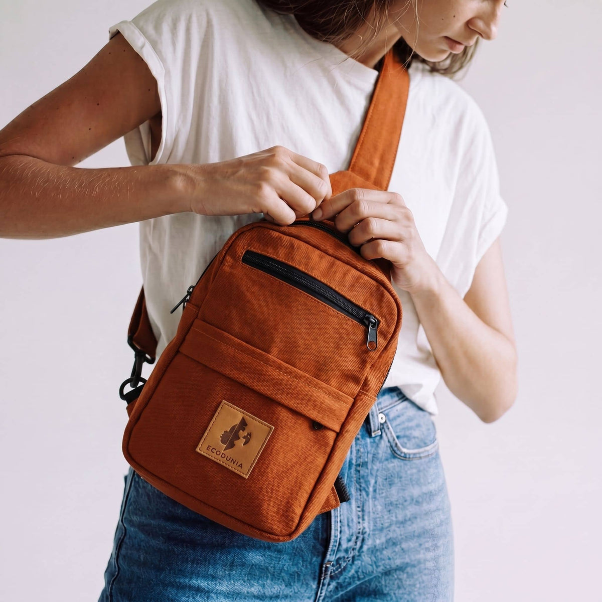 Umoja rust canvas outdoor crossbody sling bag #color_rust