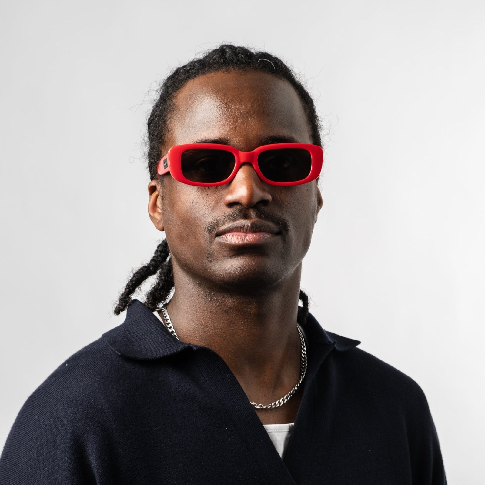 Male wearing Sad Eyewear Bouquet rectangle sunglasses in cherry red with uv protection lenses