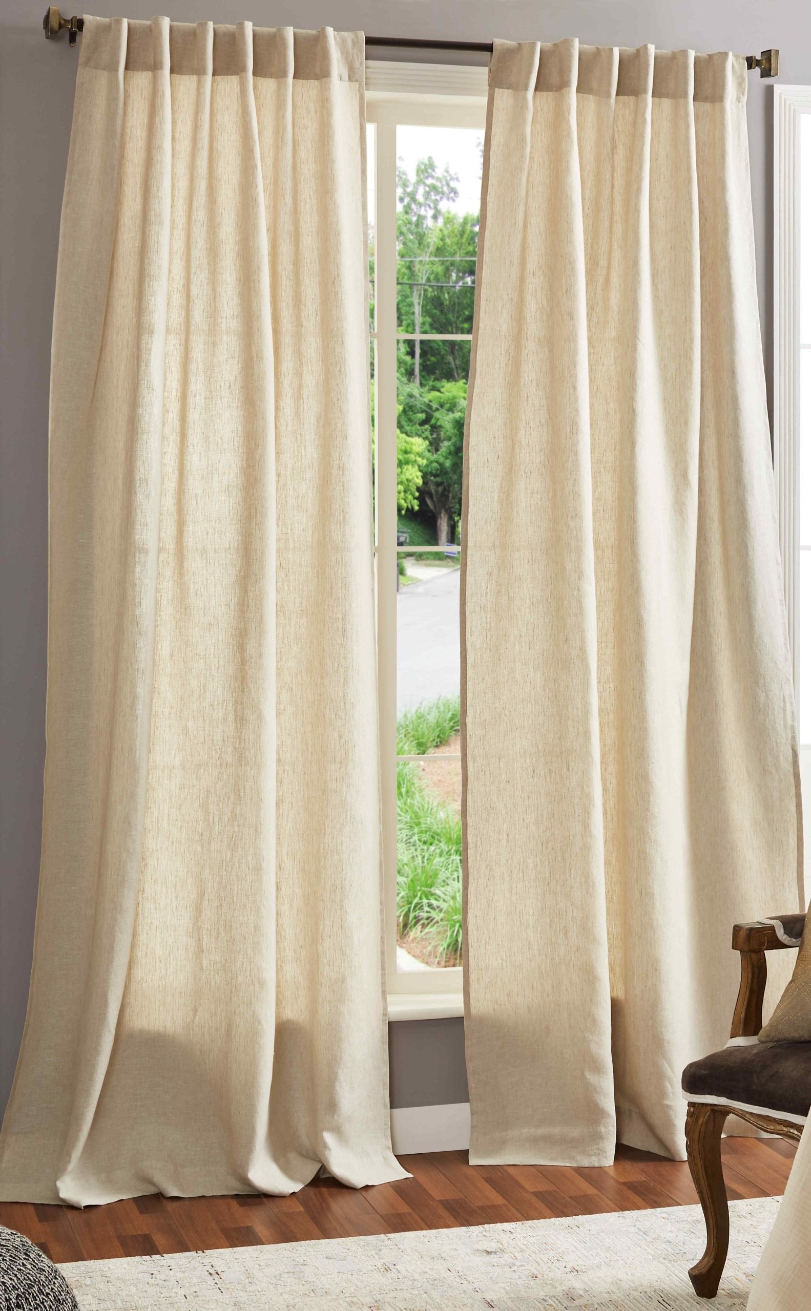 DY-711-5096_1|Full length natural linen-look curtains providing light filtering for a bright bedroom, adding an airy and sophisticated touch to decor.