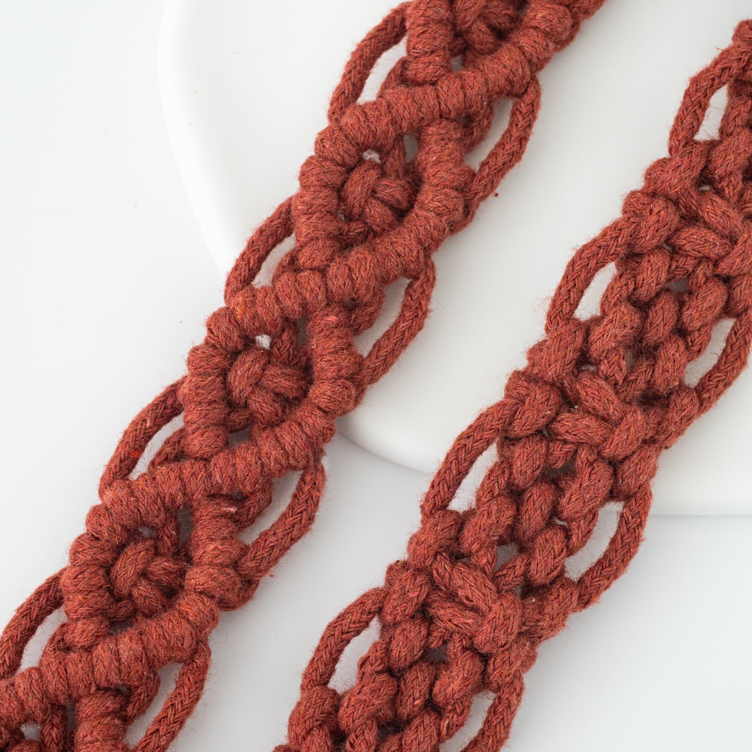 Details of red macrame phone strap accessory, hand made quality accessories, Starfish Project