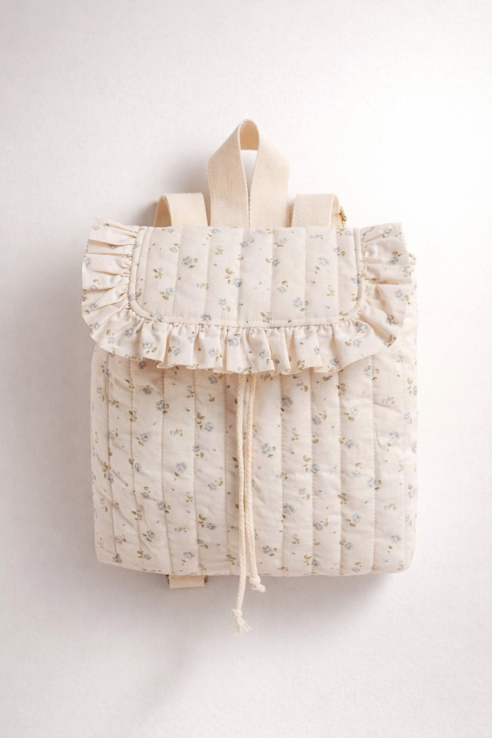 Floral-patterned backpack with ruffles on a white background